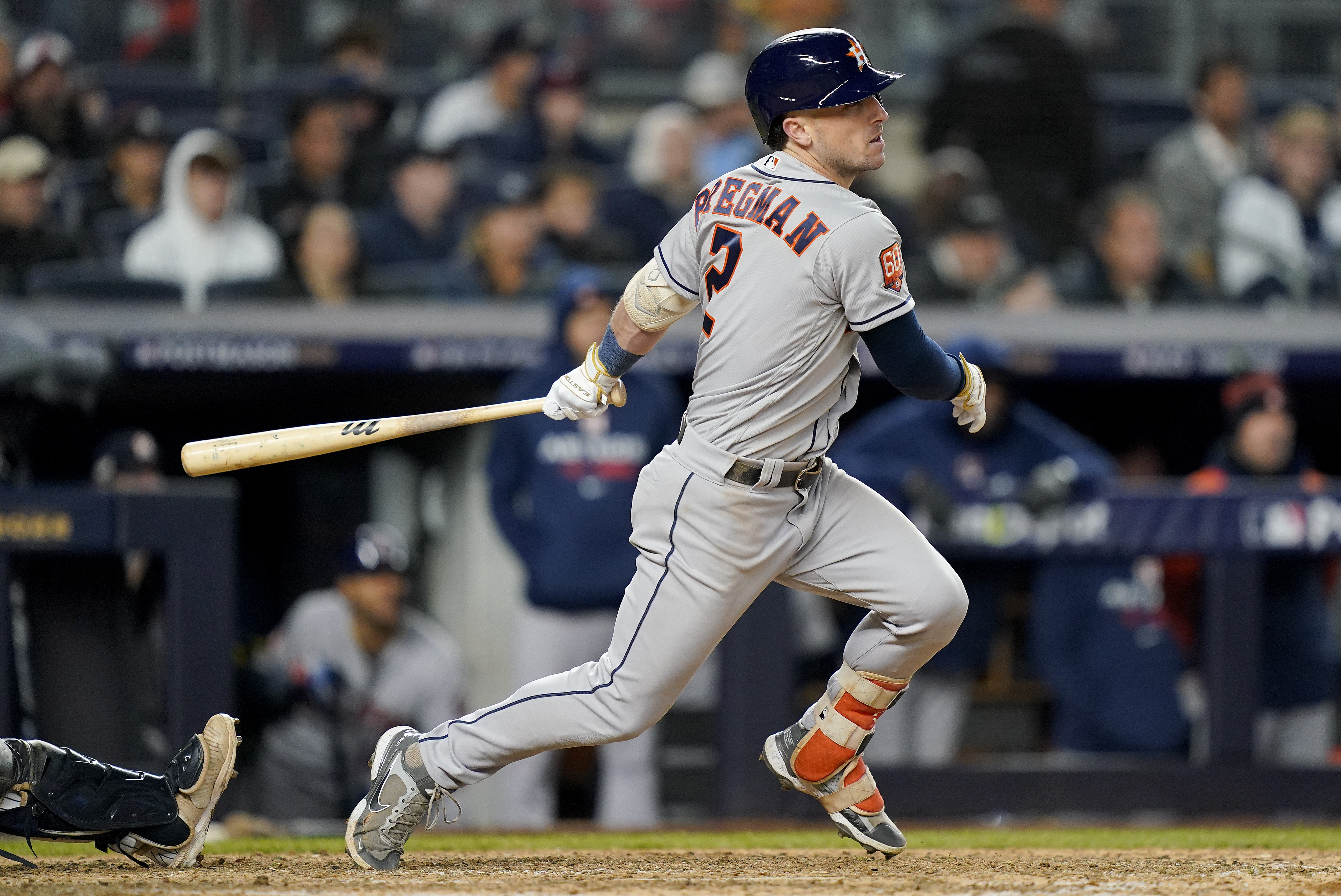Houston Astros Alex Bregman (2) follows through on a base hit to drive in a run against the New York Yankees during the seventh inning of Game 4 of an American League Championship baseball series, Sunday, Oct. 23, 2022, in New York. 