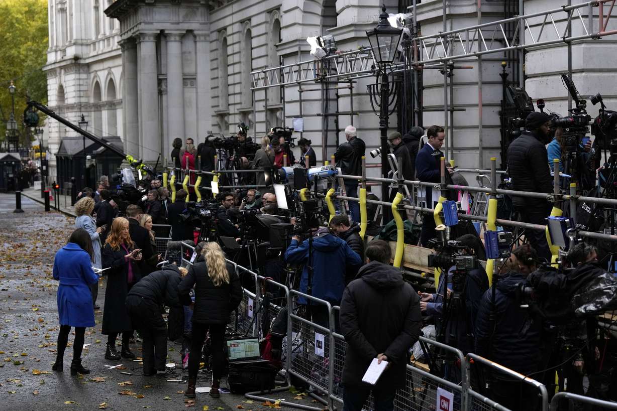 The media begins to gather outside of 10 Downing Street in London, Monday.