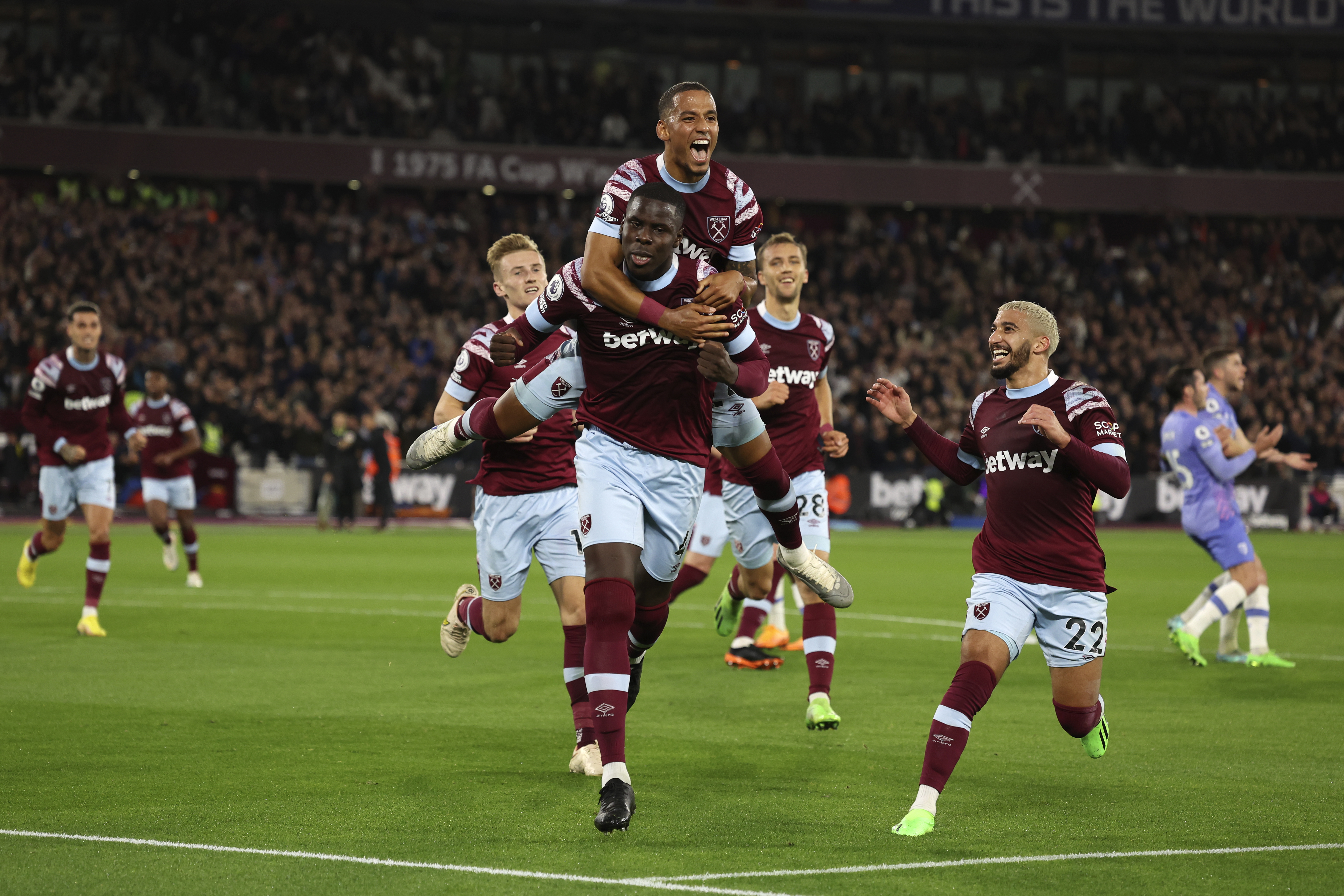 West Ham's Kurt Zouma, center, celebrates with teammates after scoring his sides first goal during the English Premier League soccer match between West Ham United and Bournemouth at the London Stadium in London, England, Monday, Oct. 24, 2022.