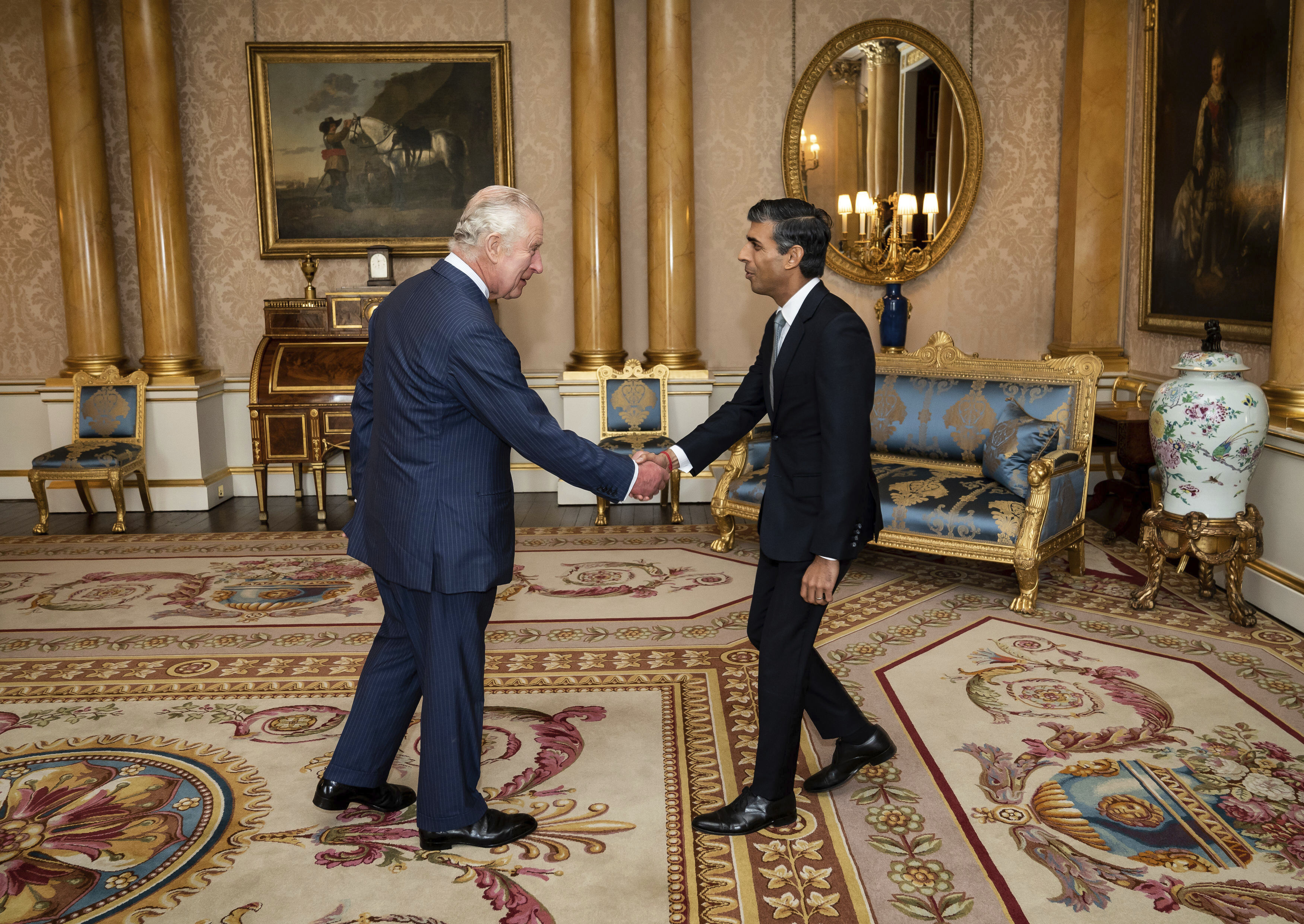 King Charles III welcomes Rishi Sunak during an audience at Buckingham Palace, London, where he invited the newly elected leader of the Conservative Party to become Prime Minister and form a new government, Tuesday, Oct. 25.