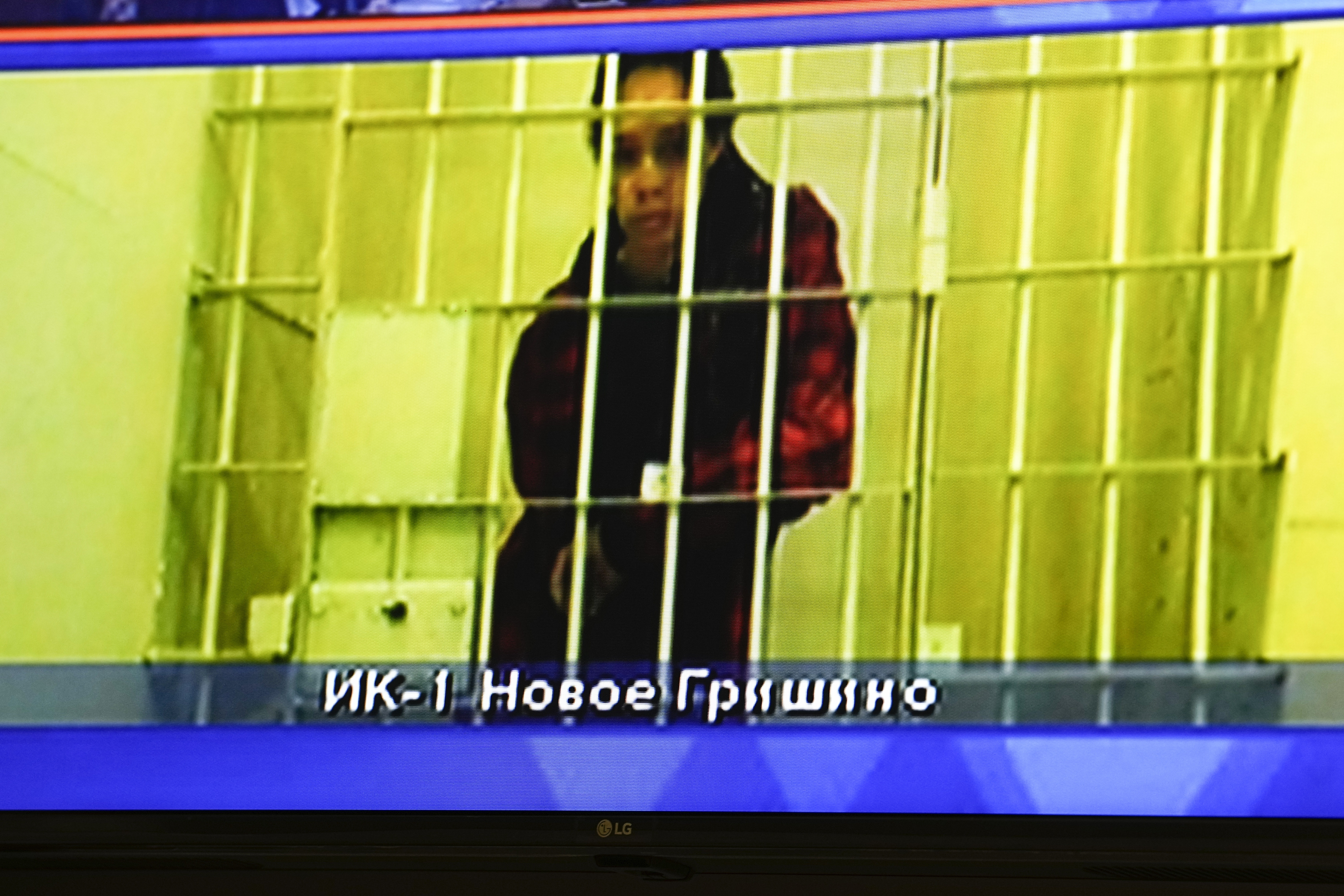 WNBA star and two-time Olympic gold medalist Brittney Griner is seen on the bottom part of a TV screen as she waits to appear in a video link provided by the Russian Federal Penitentiary Service a courtroom prior to a hearing at the Moscow Regional Court in Moscow, Russia, Tuesday.