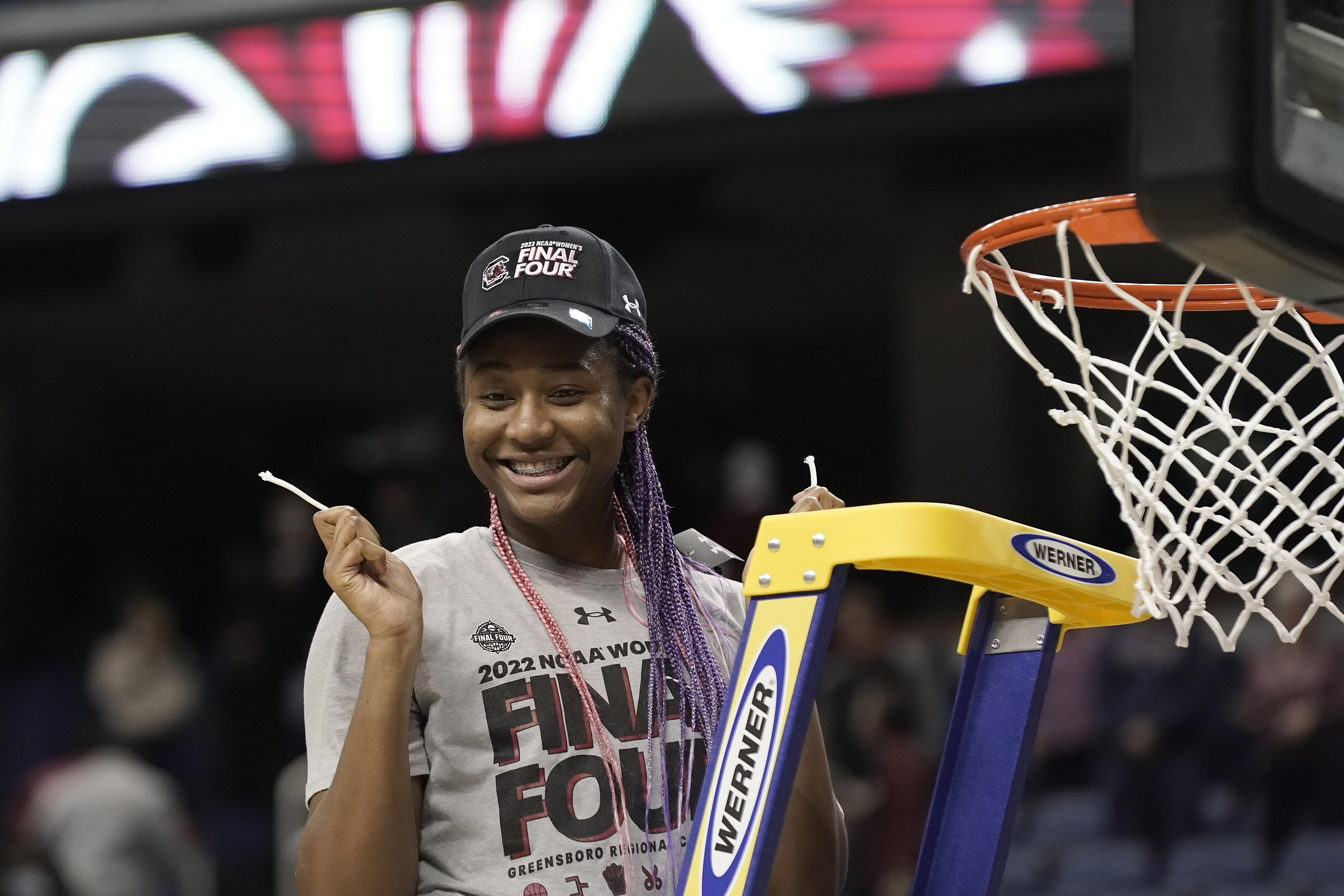 FILE - South Carolina forward Aliyah Boston (4) reacts after cutting the net following a college basketball game against Creighton in the Elite 8 round of the NCAA tournament in Greensboro, N.C., Sunday, March 27, 2022. Boston is a unanimous choice to the women's Associated Press preseason All-America team, Tuesday, Oct. 25, 2022. 