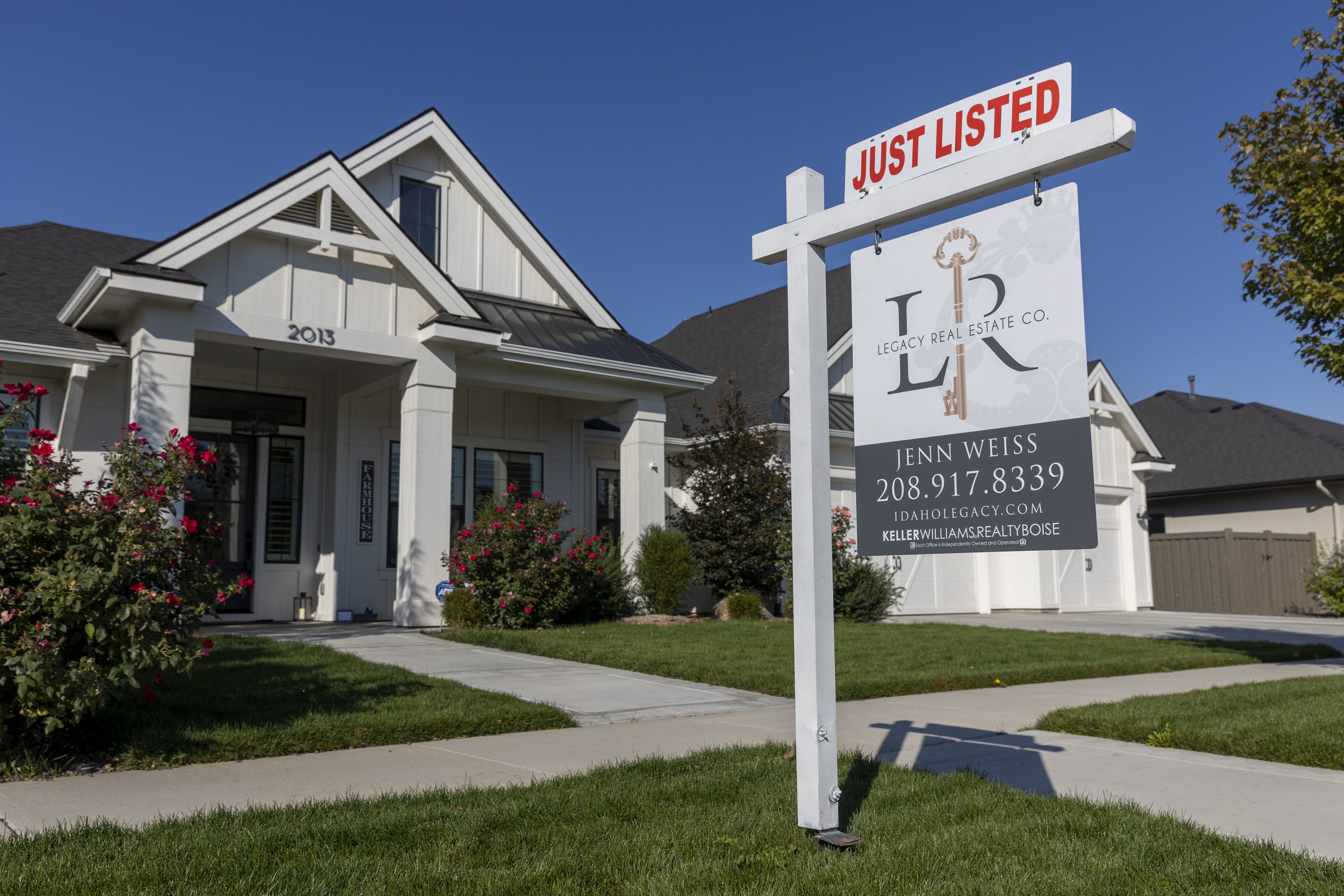 A “Just Listed” sign is pictured in front of a new home in Eagle, Idaho, on sept. 23, 2022.
