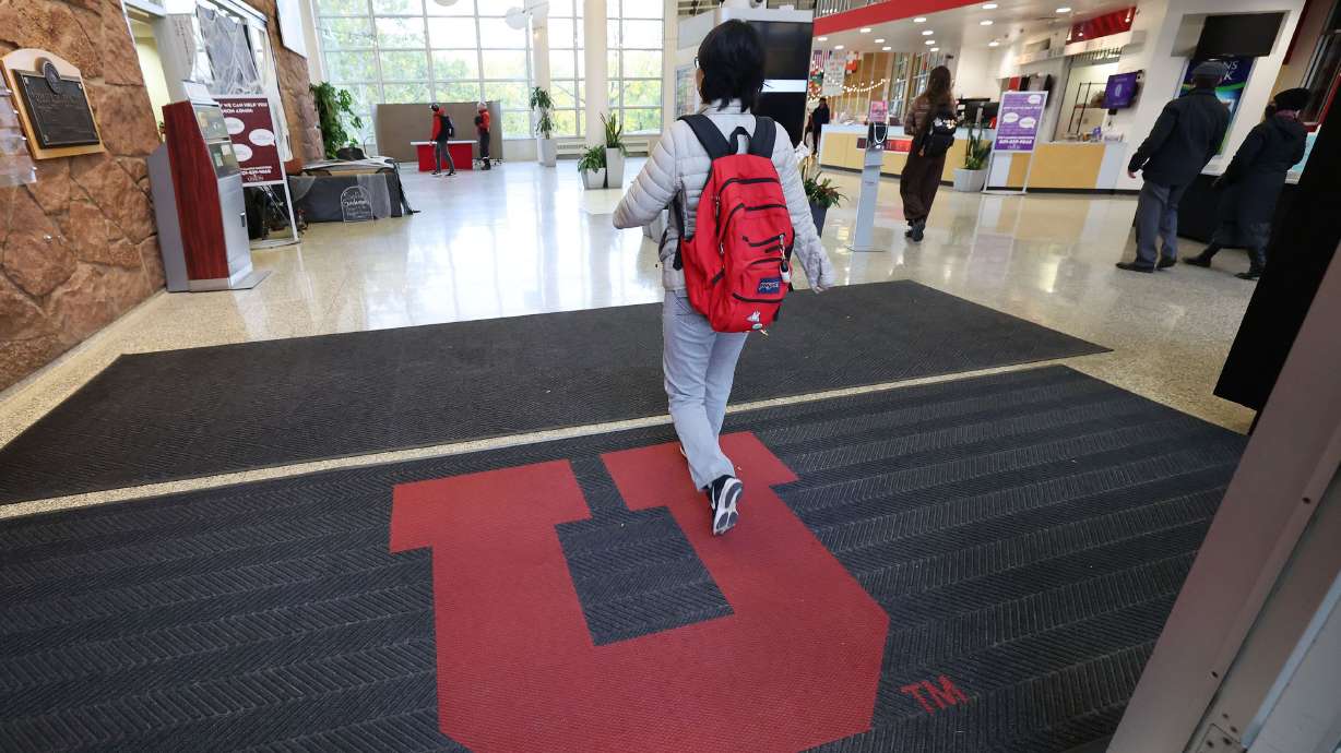University of Utah students walk into the Union Building on campus in Salt Lake City on Tuesday. Utah Gov. Spencer Cox is talking about an across-the-board tuition freeze.
