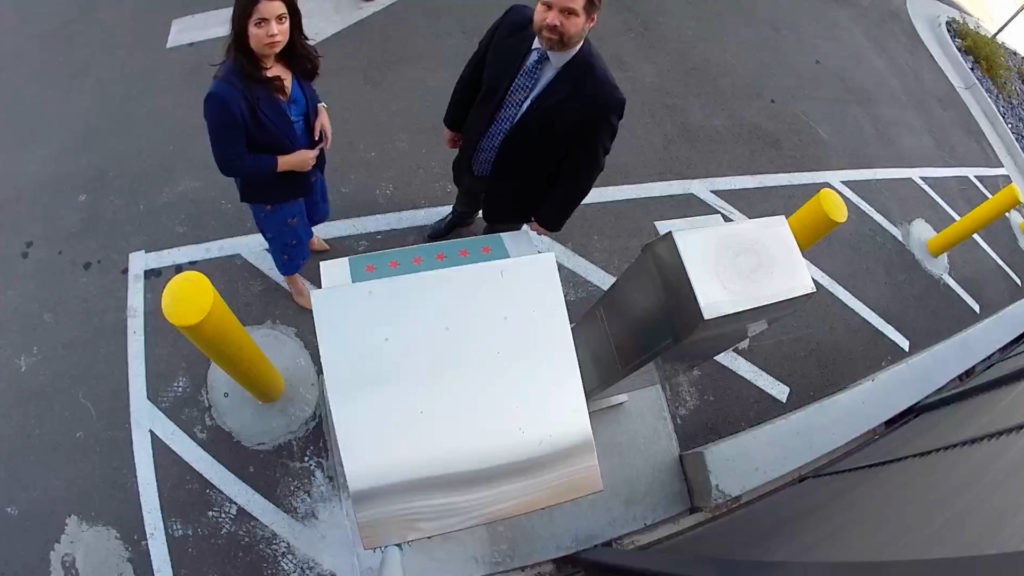 KSL's Daniella Rivera and Weber County clerk/auditor Ricky Hatch are seen on a Weber County ballot camera.