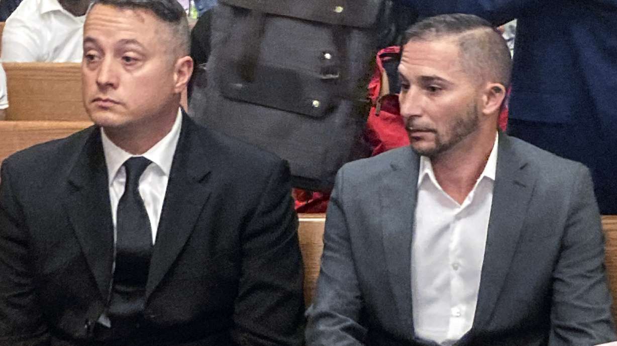 Jacob Runyan, left, and Chase Cominsky, sit in court as they are arraigned, Wednesday, Oct. 26, 2022, in Cleveland. The two pleaded not guilty to cheating and other charges in a lucrative fishing tournament on Lake Erie in the end of September where they were accused of stuffing five walleye with lead weights and fish filets.