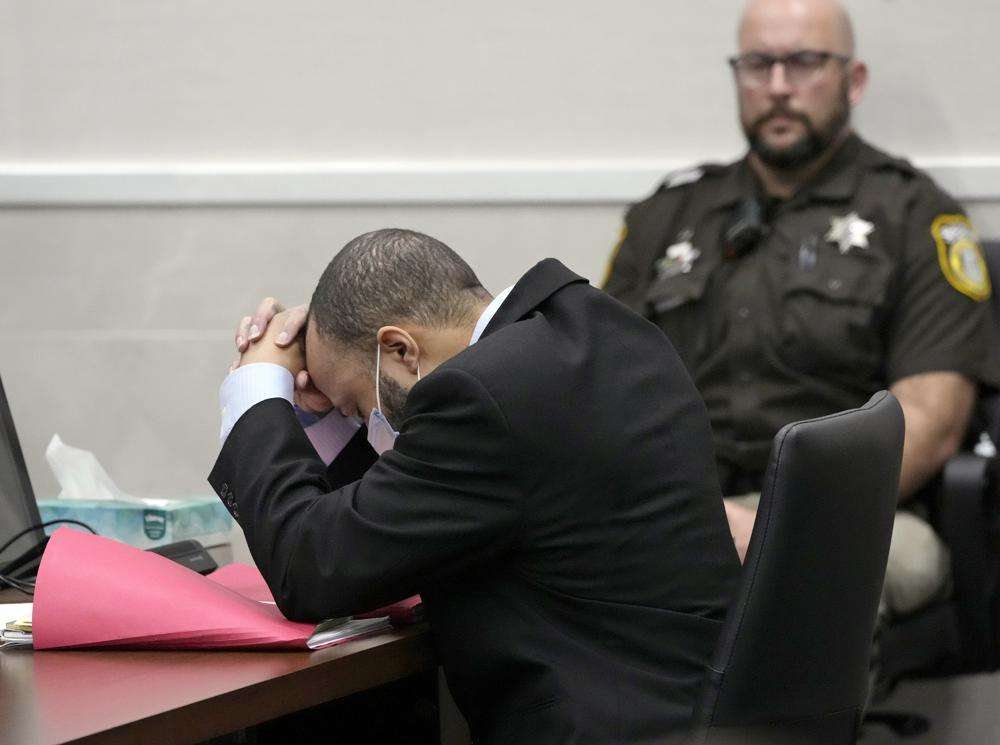 Darrell Brooks reacts as the guilty verdict is read during his trial in a Waukesha County Circuit Court in Waukesha, Wis., on Wednesday. Brooks represented himself during the trial and was charged with driving into a Waukesha Christmas Parade last year, killing six people and injuring dozens more. Brooks was found guilty Wednesday of all 76 charges, including six counts of first-degree intentional homicide.