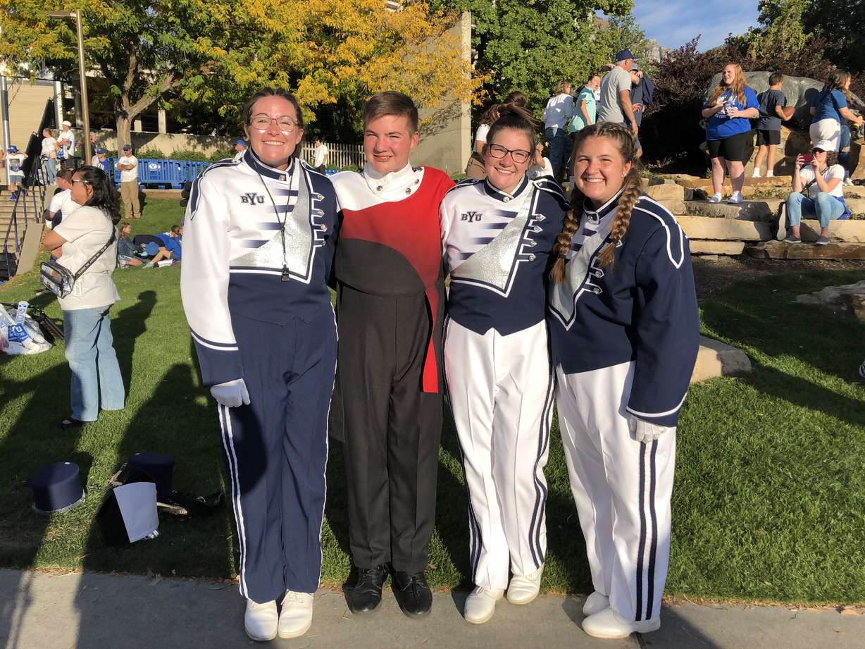 Emily, Reid, Sarah and Megan Rogers pose for a picture following the BYU Football game on Oct. 22. They are each members of the marching band at their respective schools, including BYU and American Fork High School.