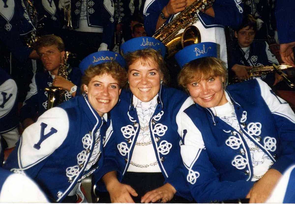An old photo of Sherri Rogers, center, and friends in the BYU marching band decades ago. Rogers' daughters, Emily, Sarah and Megan Rogers, also made it into the BYU marching band.