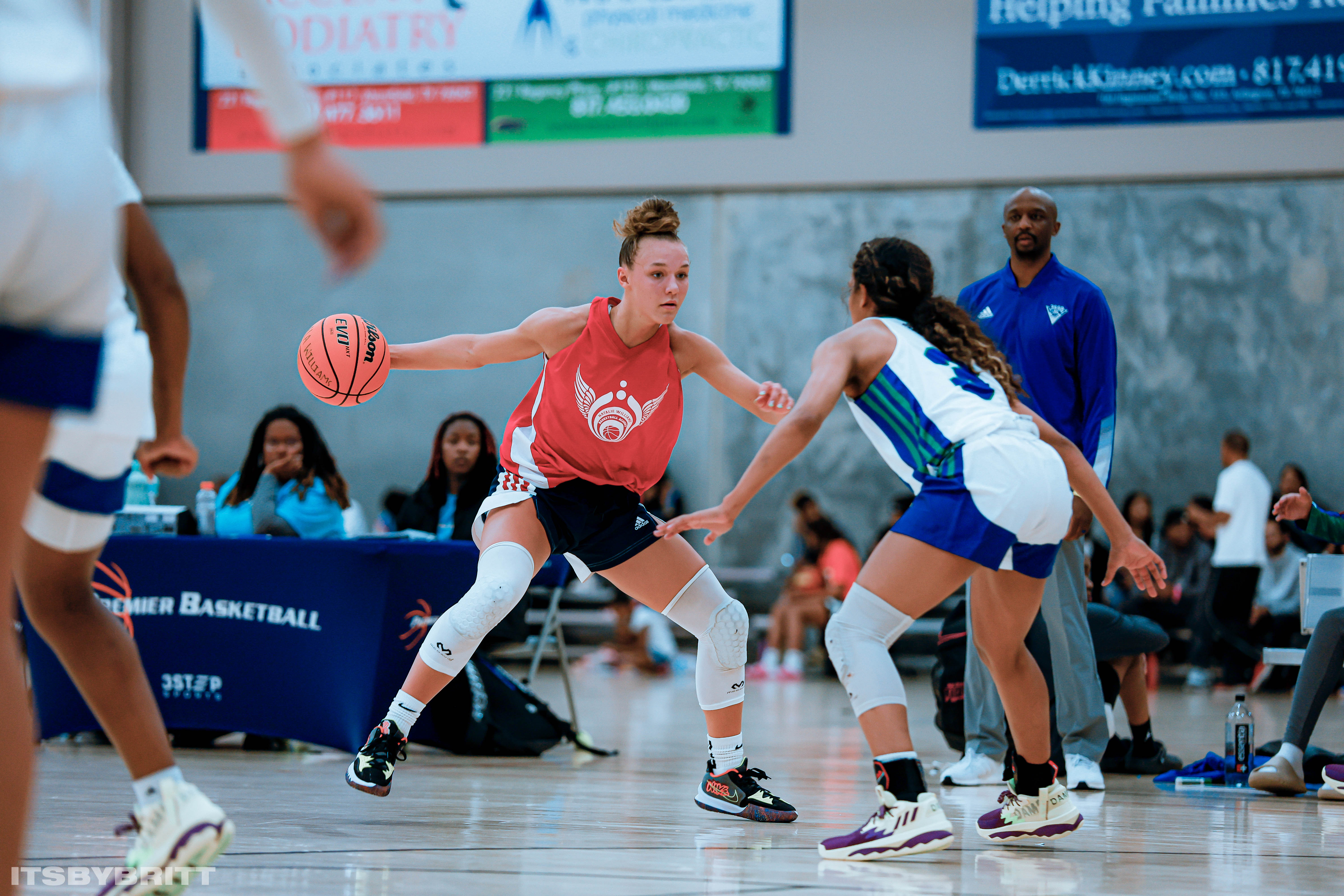 BYU commit Amari Whiting with her AAU team, Natalie Williams Basketball Academy, during a game over the summer of 2022. Whiting, whose mother Amber was recently named head coach of the BYU women's basketball team, suffered a torn ACL on a visit and will enroll early to aid her recovery and join the team in the Big 12 in July 2023.