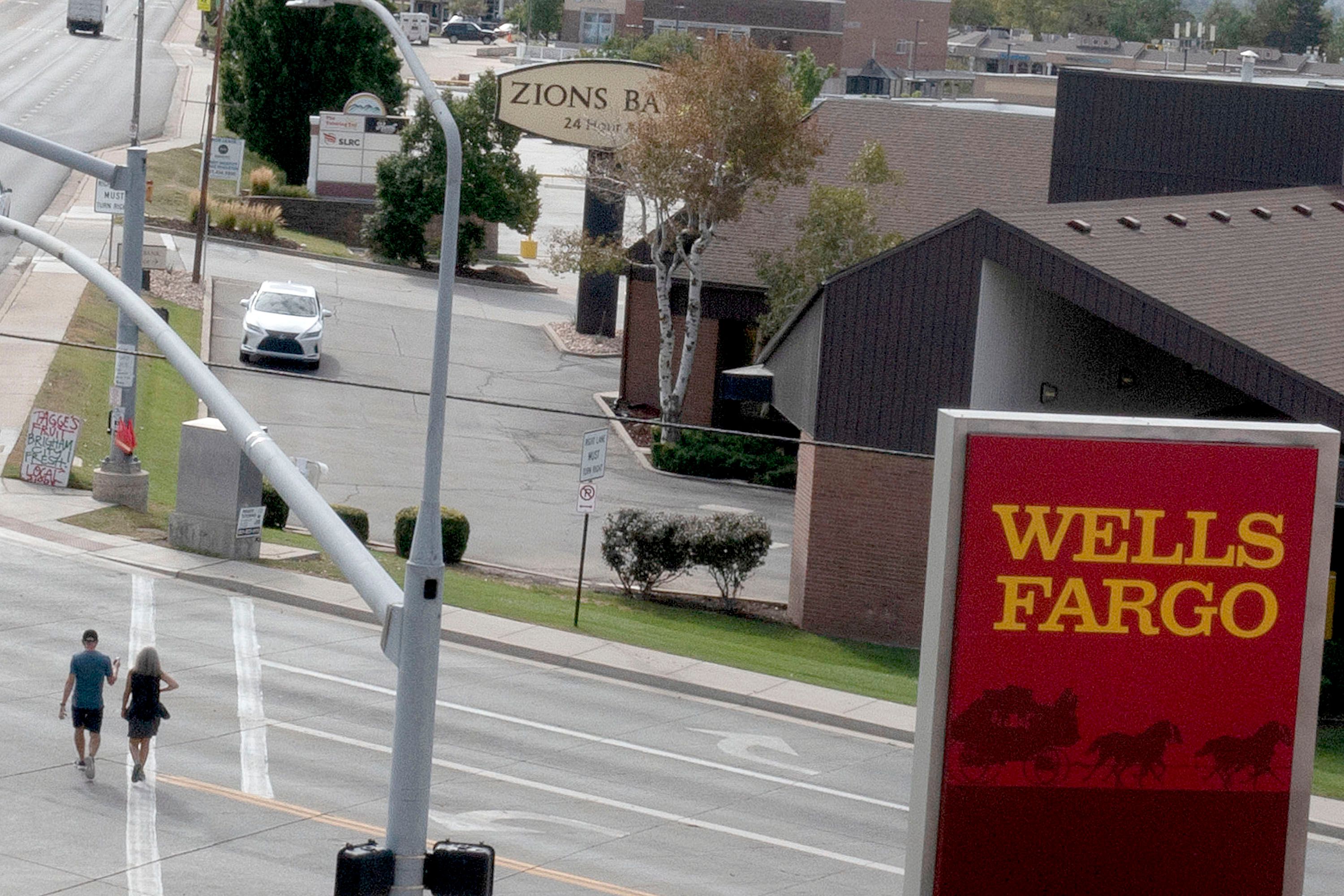A Wells Fargo and a Zions Bank are pictured on Foothill Drive in Salt Lake City on Sept. 15. Home mortgages have risen to 7%, the highest mark since 2001.