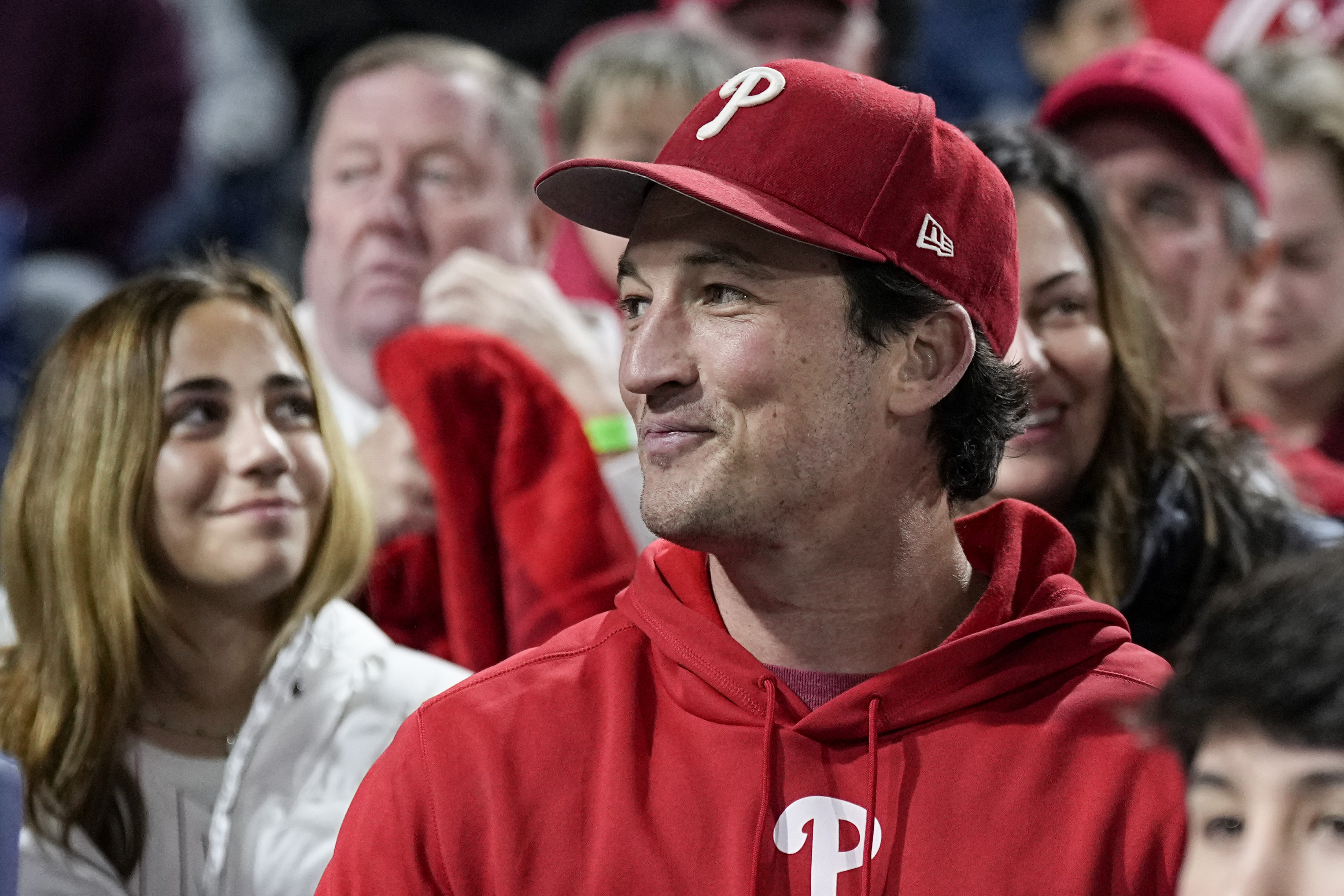 Actor, Miles Teller watches during the fourth inning in Game 3 of the baseball NL Championship Series between the San Diego Padres and the Philadelphia Phillies on Friday, Oct. 21, 2022, in Philadelphia. 