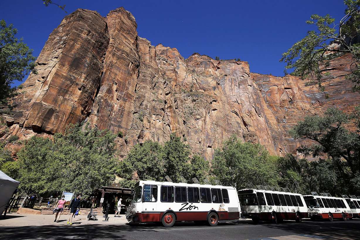 Visitors board shuttles at Zion National Park on Oct. 14, 2020. Zion is one of five national parks in southern Utah.
