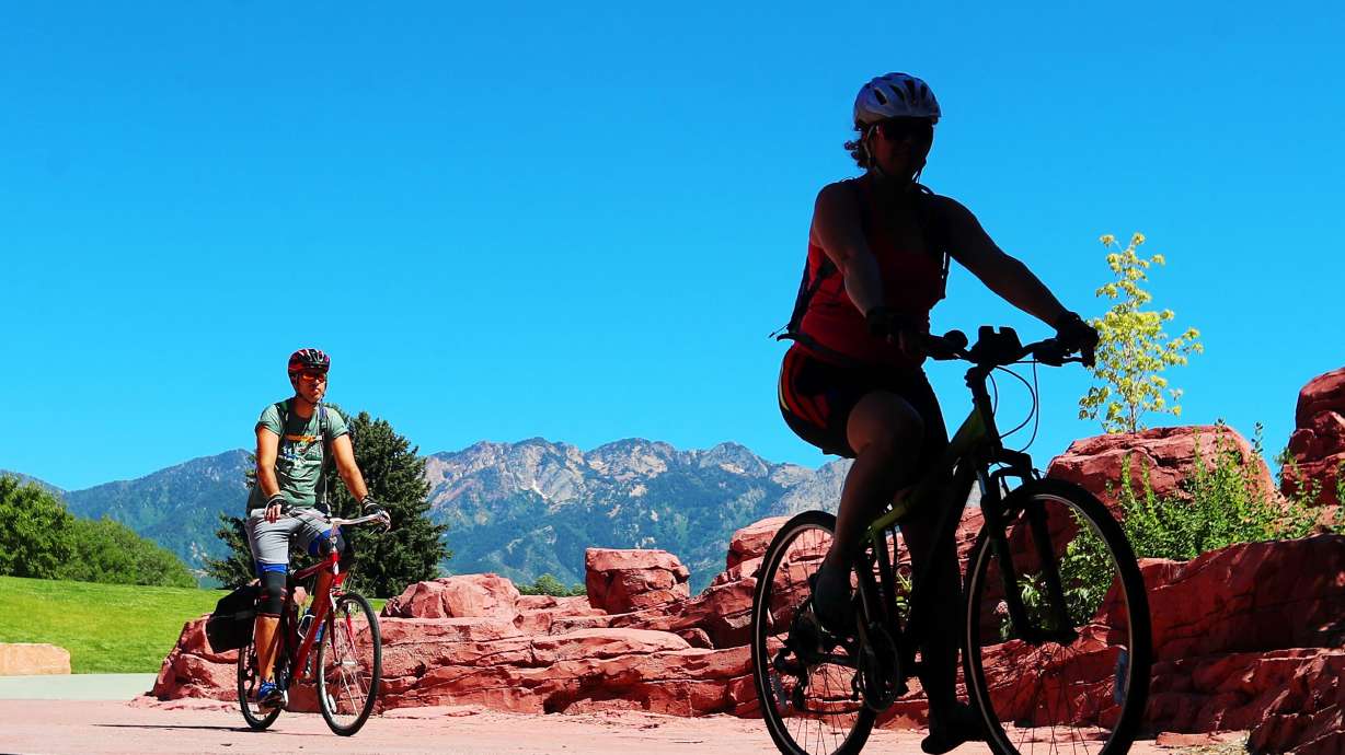 A pair of bicyclists go into the tunnel under 1300 East at Sugar House Park in Salt Lake City on June 22, 2020. Three projects tied to the new Highland High School will affect the popular park beginning this year, park officials said on Monday.