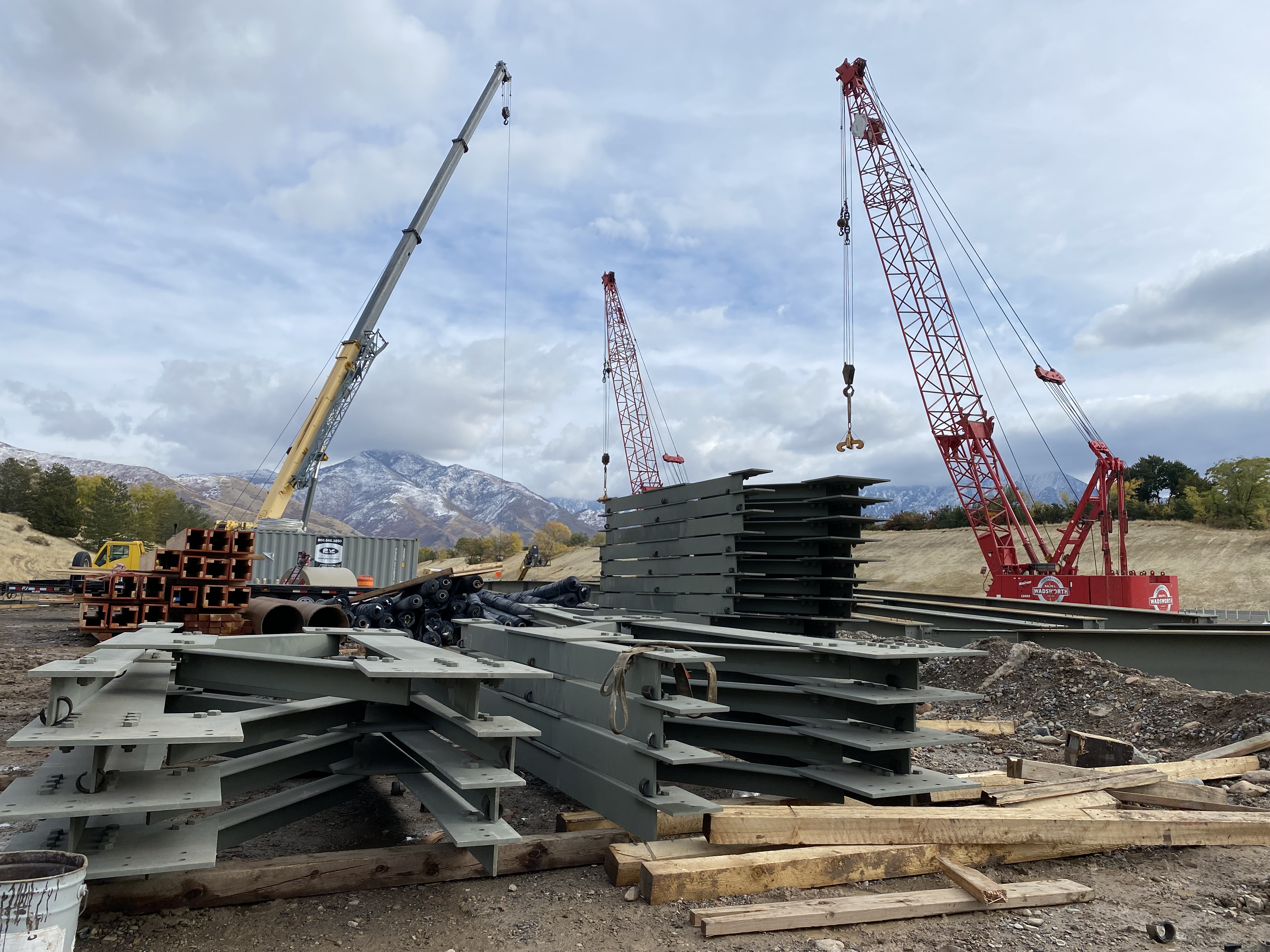 Construction crews prepare to lift 11 steel girders into place over I-80 in Salt Lake City on Thursday. The process will close the freeway in both directions twice over the weekend, according to the Utah Department of Transportation.