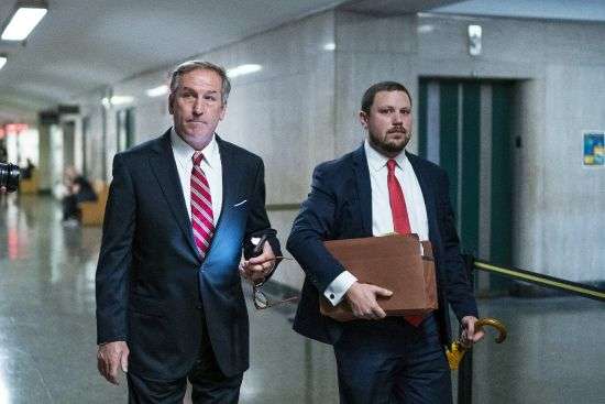 Defense attorney Michael van der Veen, left, arrives to the criminal courtroom, Monday, in New York. It’s taken just three days to seat a jury of 12 people in the tax fraud trial of Donald Trump’s company — surprising even some people involved in the case who thought it would take at least a week to find an impartial panel in heavily Democratic New York City. Five of the jurors were sworn in Thursday, joining seven who were picked Tuesday.