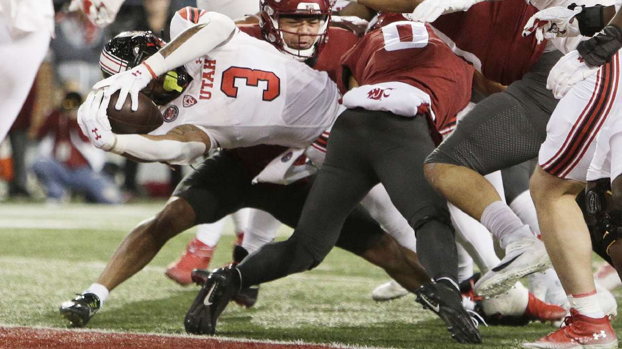 Utah running back Ja'Quinden Jackson (3) reaches for a touchdown during the first half of an NCAA college football game against Washington State, Thursday, Oct. 27, 2022, in Pullman, Wash.
