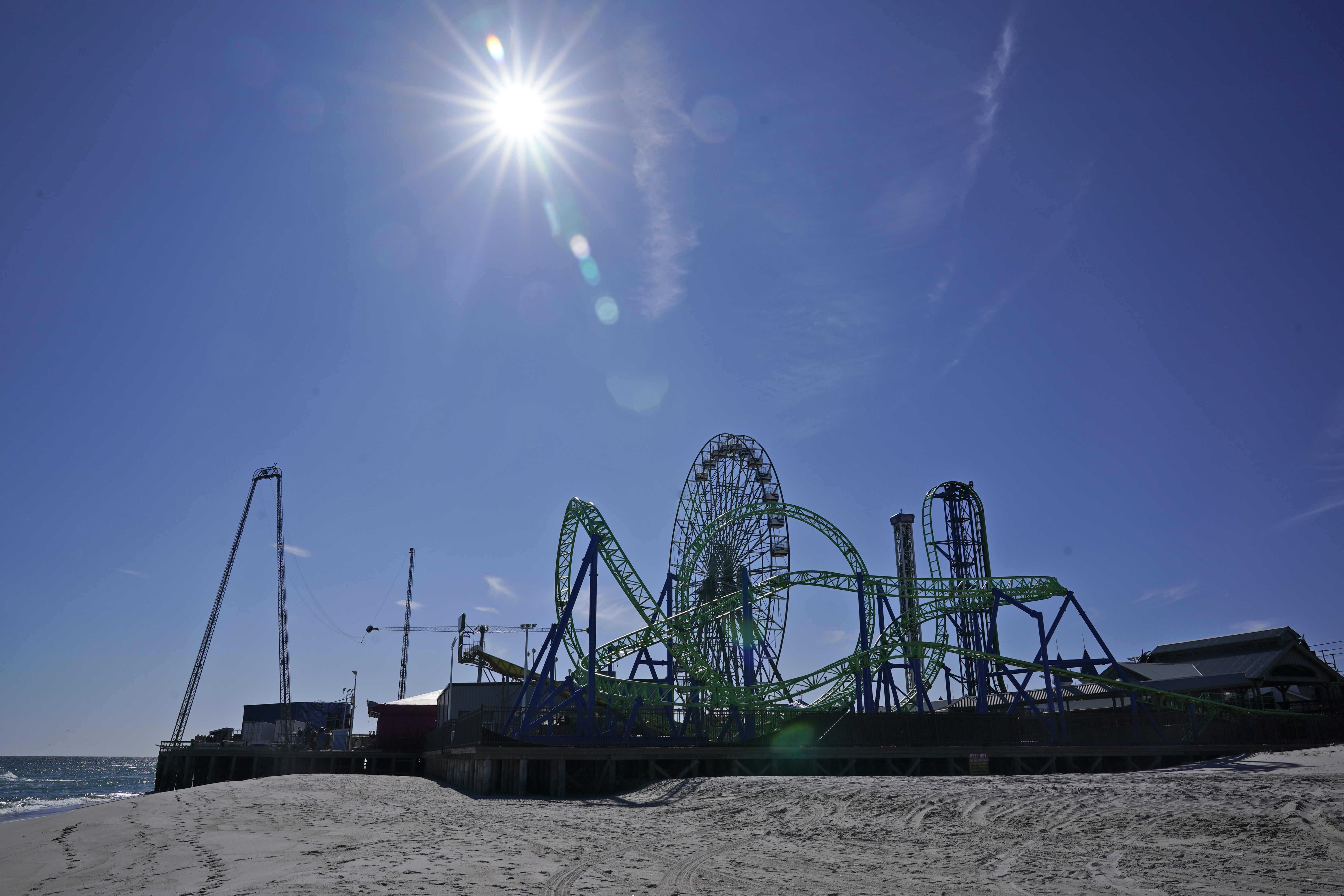 An amusement park sits next to the ocean in Seaside Heights, N.J., Oct. 20, 2022. The Jet Star roller coaster, whose collapse into the ocean at Seaside Heights, N.J. during Sandy provided an iconic image of the storm's destruction, has been replaced with a new ride, built on the beach instead of over the water like its predecessor.
