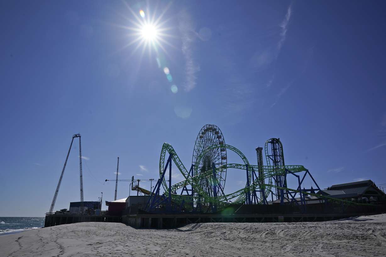 An amusement park sits next to the ocean in Seaside Heights, N.J., Oct. 20, 2022. The Jet Star roller coaster, whose collapse into the ocean at Seaside Heights, N.J. during Sandy provided an iconic image of the storm's destruction, has been replaced with a new ride, built on the beach instead of over the water like its predecessor.