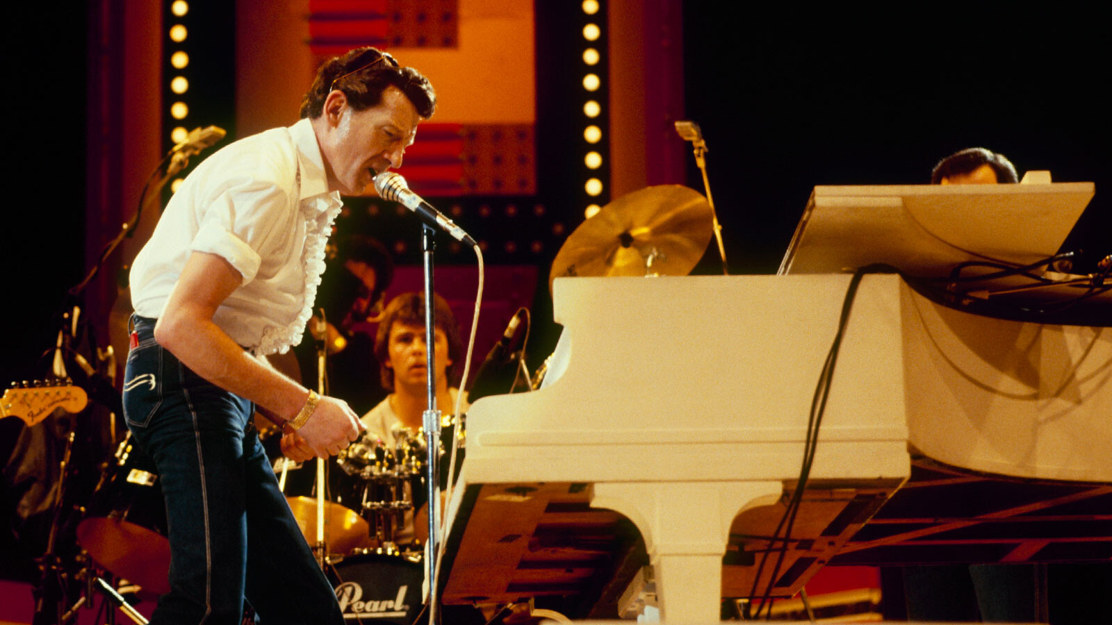 Jerry Lee Lewis performs on stage at the Country Music Festival held at Wembley Arena, London, in April 1982.