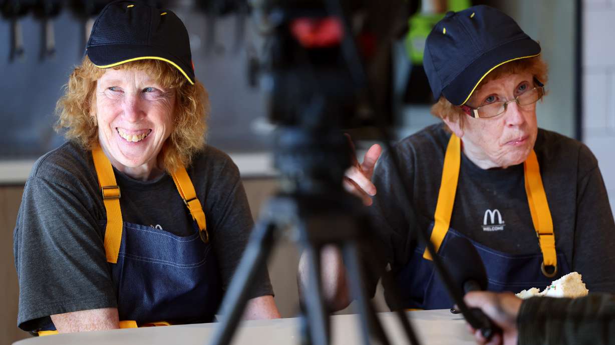Ellen Hamilton looks at co-workers and smiles as she and her sister Elaine Hamilton are interviewed. The twin sisters have worked at the 3300 S. Main Street McDonald's for 40 years and were recognized at the location in Salt Lake City on Friday.