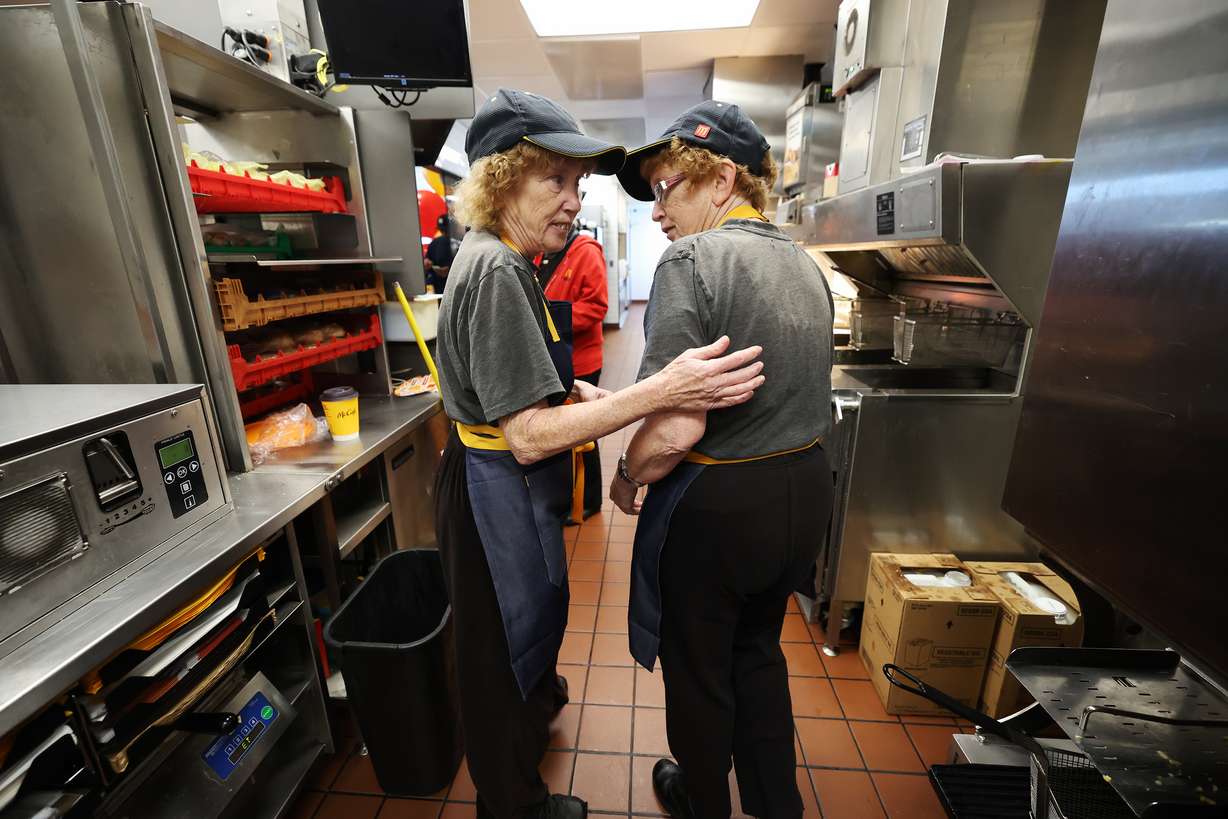 Ellen and Elaine Hamilton, McDonald’s crew members show some of their work areas at the 3300 S. Main Street location in Salt Lake City, where the two have worked for 40 years and were recognized on Friday.