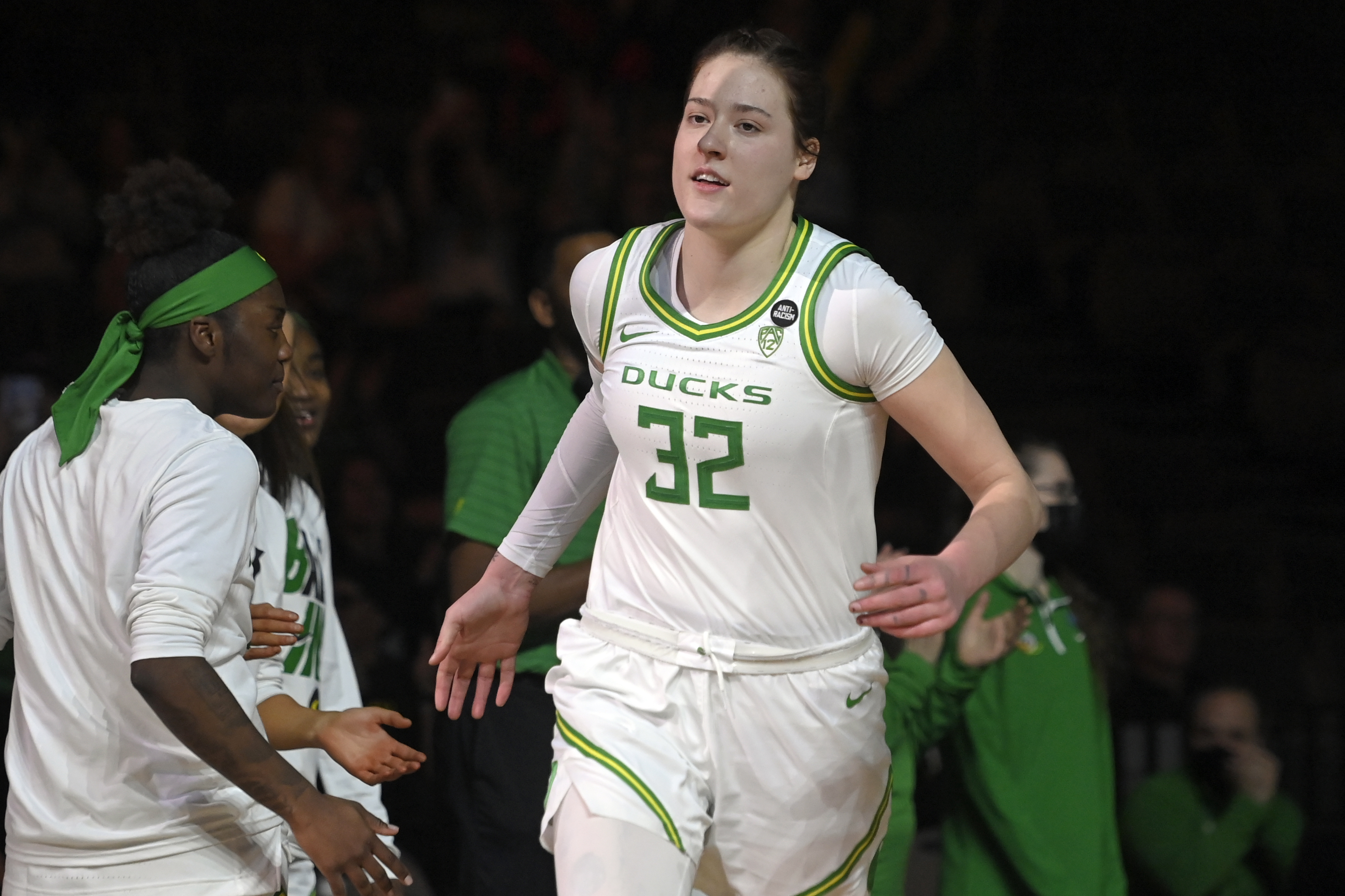 FILE - Oregon forward Sedona Prince (32) is introduced before an NCAA college basketball game against UCLA in the quarterfinals of the Pac-12 women's tournament March 3, 2022, in Las Vegas. Prince's career at Oregon has ended with a torn elbow ligament that will require surgery. 