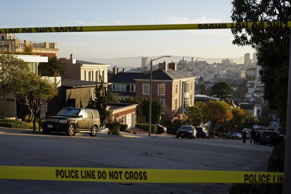 Police tape blocks a street outside the home of Paul Pelosi, the husband of House Speaker Nancy Pelosi, in San Francisco, Friday. Paul Pelosi, was attacked and severely beaten by an assailant with a hammer who broke into their San Francisco home early Friday, according to people familiar with the investigation.