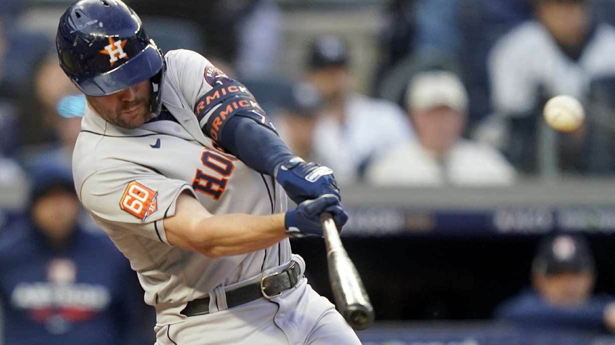 Houston Astros Chas McCormick (20) connects for a two-run home run against the New York Yankees during the second inning of Game 3 of an American League Championship baseball series, Saturday, Oct. 22, 2022, in New York.