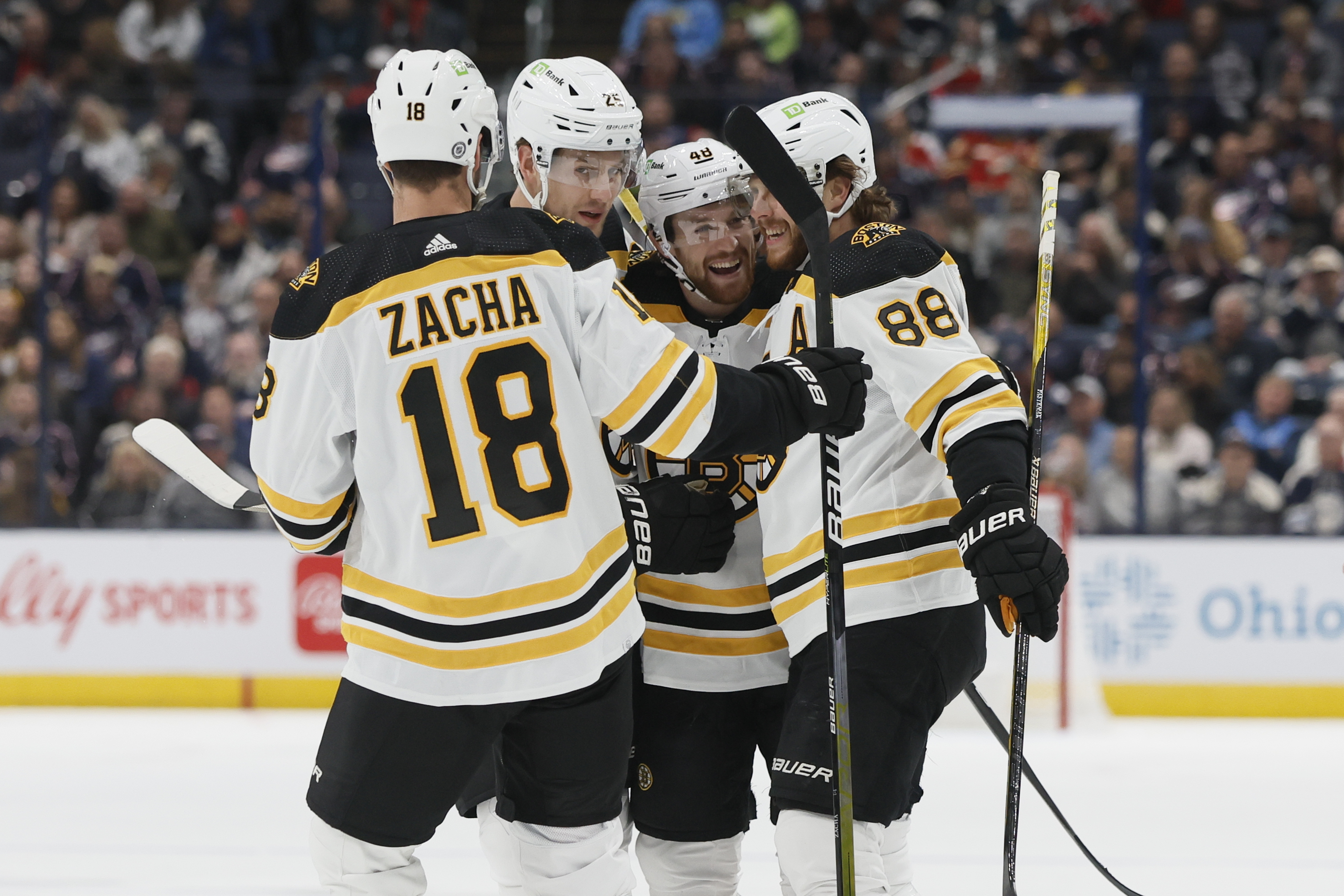 Boston Bruins' Matt Grzelcyk, second from right, celebrates with teammates after his goal against the Columbus Blue Jackets during the first period of an NHL hockey game Friday, Oct. 28, 2022, in Columbus, Ohio. 