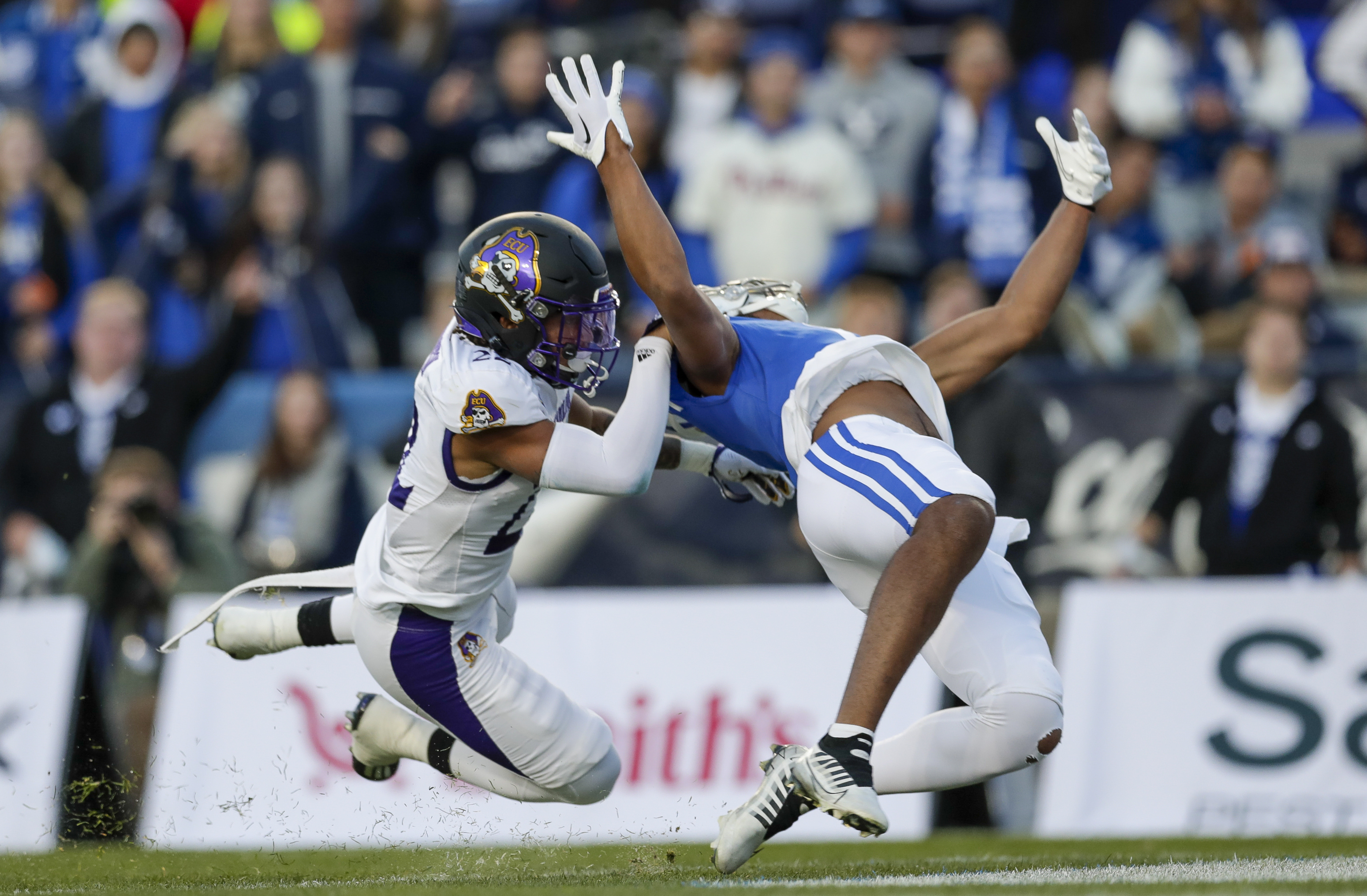 East Carolina defensive back Aapri Washington (22) interferes with BYU wide receiver Keanu Hill (1) during a NCAA college football game Friday, Oct. 28, 2022, in Provo.