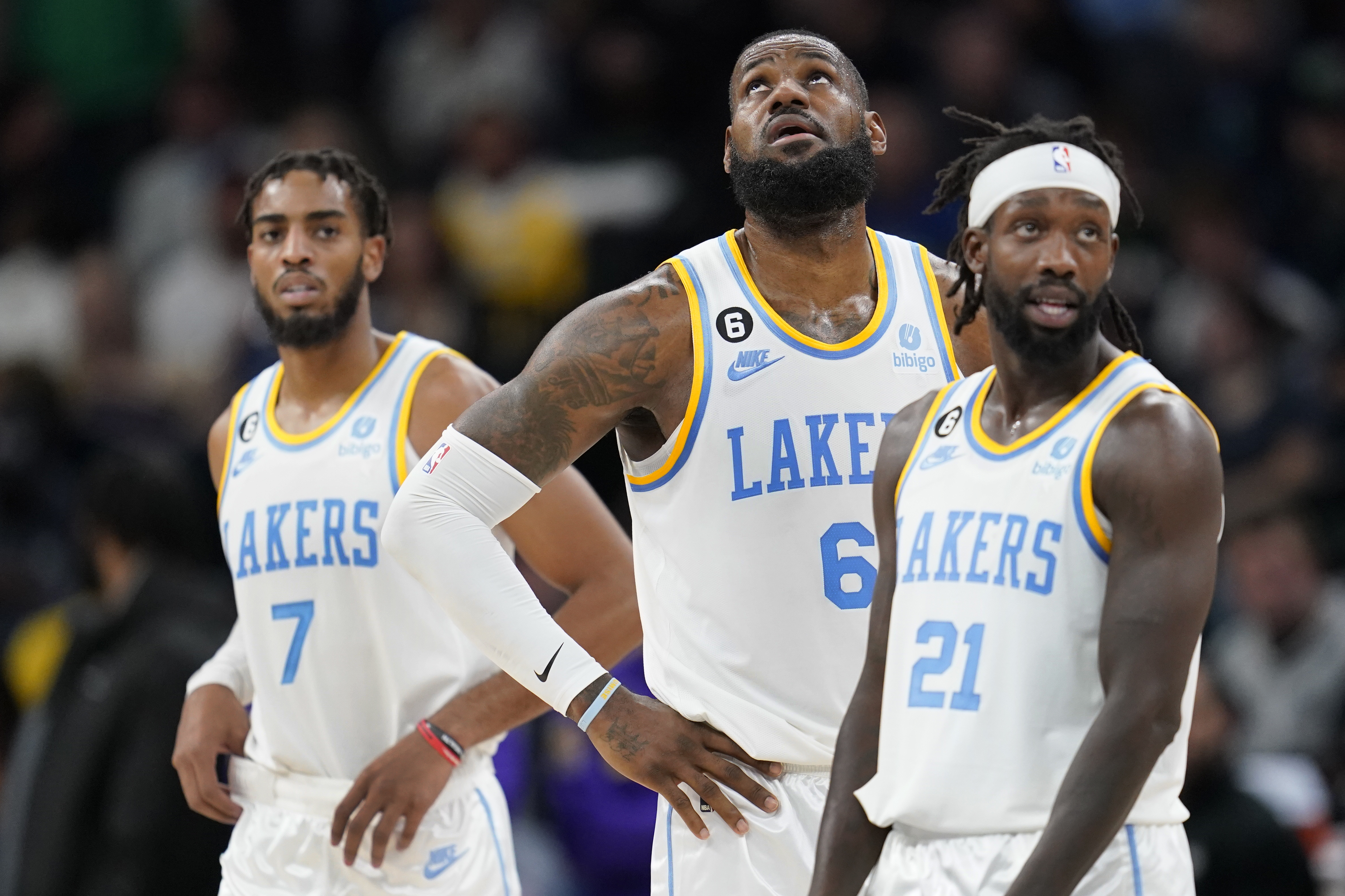 Los Angeles Lakers forward Troy Brown Jr. (7), forward LeBron James (6) and guard Patrick Beverley (21) look downcourt during the first half of an NBA basketball game against the Minnesota Timberwolves, Friday, Oct. 28, 2022, in Minneapolis. 