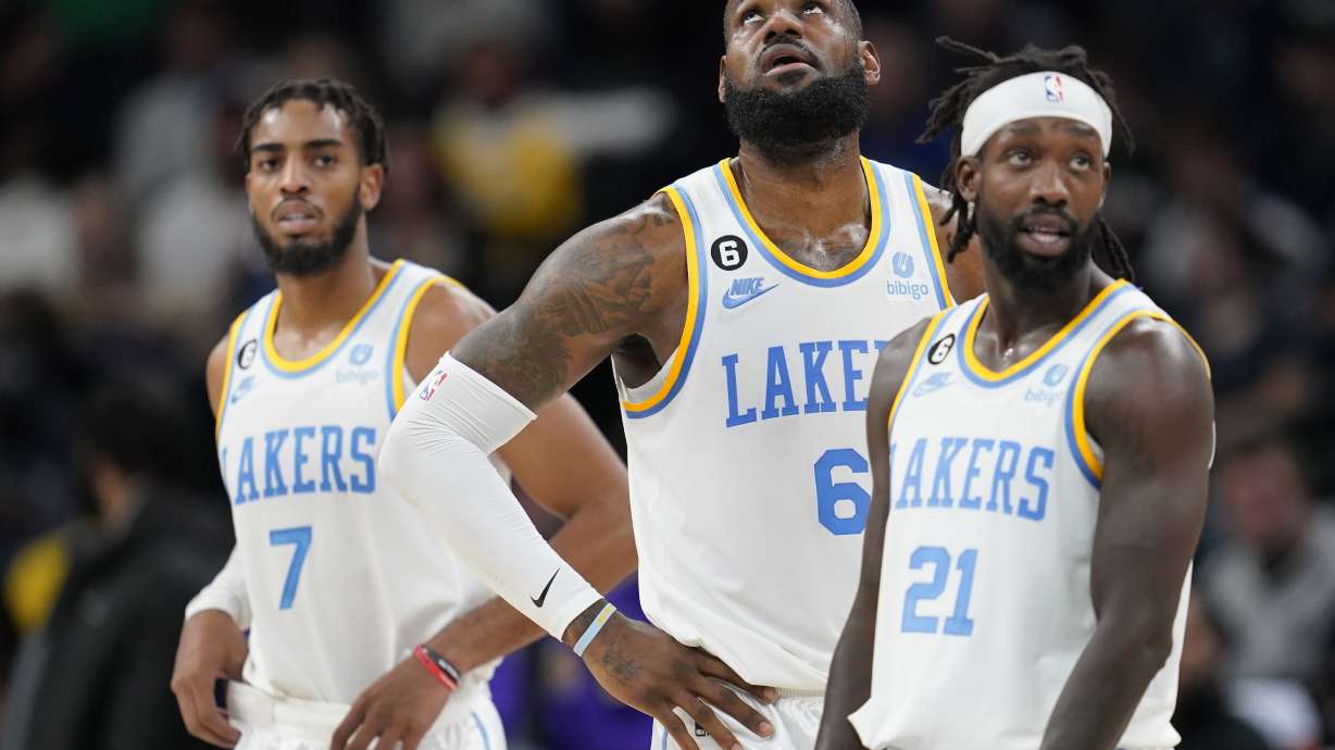 Los Angeles Lakers forward Troy Brown Jr. (7), forward LeBron James (6) and guard Patrick Beverley (21) look downcourt during the first half of an NBA basketball game against the Minnesota Timberwolves, Friday, Oct. 28, 2022, in Minneapolis.