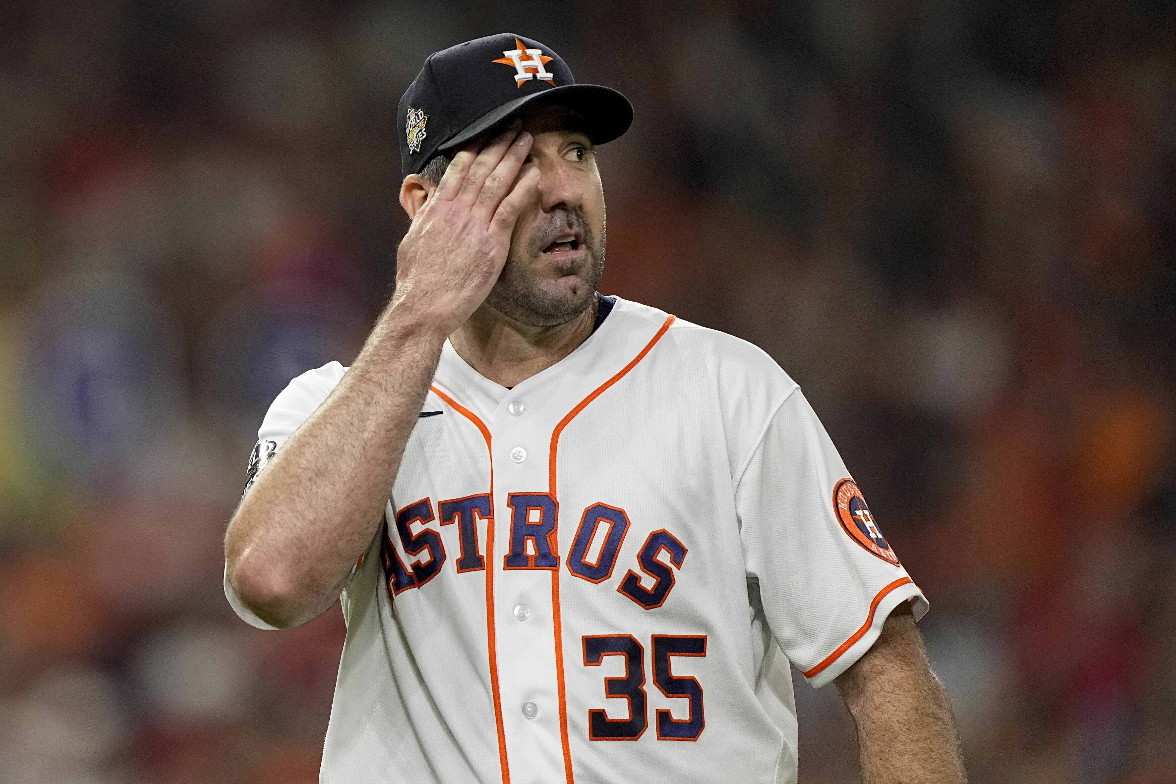 Houston Astros starting pitcher Justin Verlander walks to the dugout after the top of the first inning in Game 1 of baseball's World Series between the Houston Astros and the Philadelphia Phillies on Friday, Oct. 28, 2022, in Houston. 