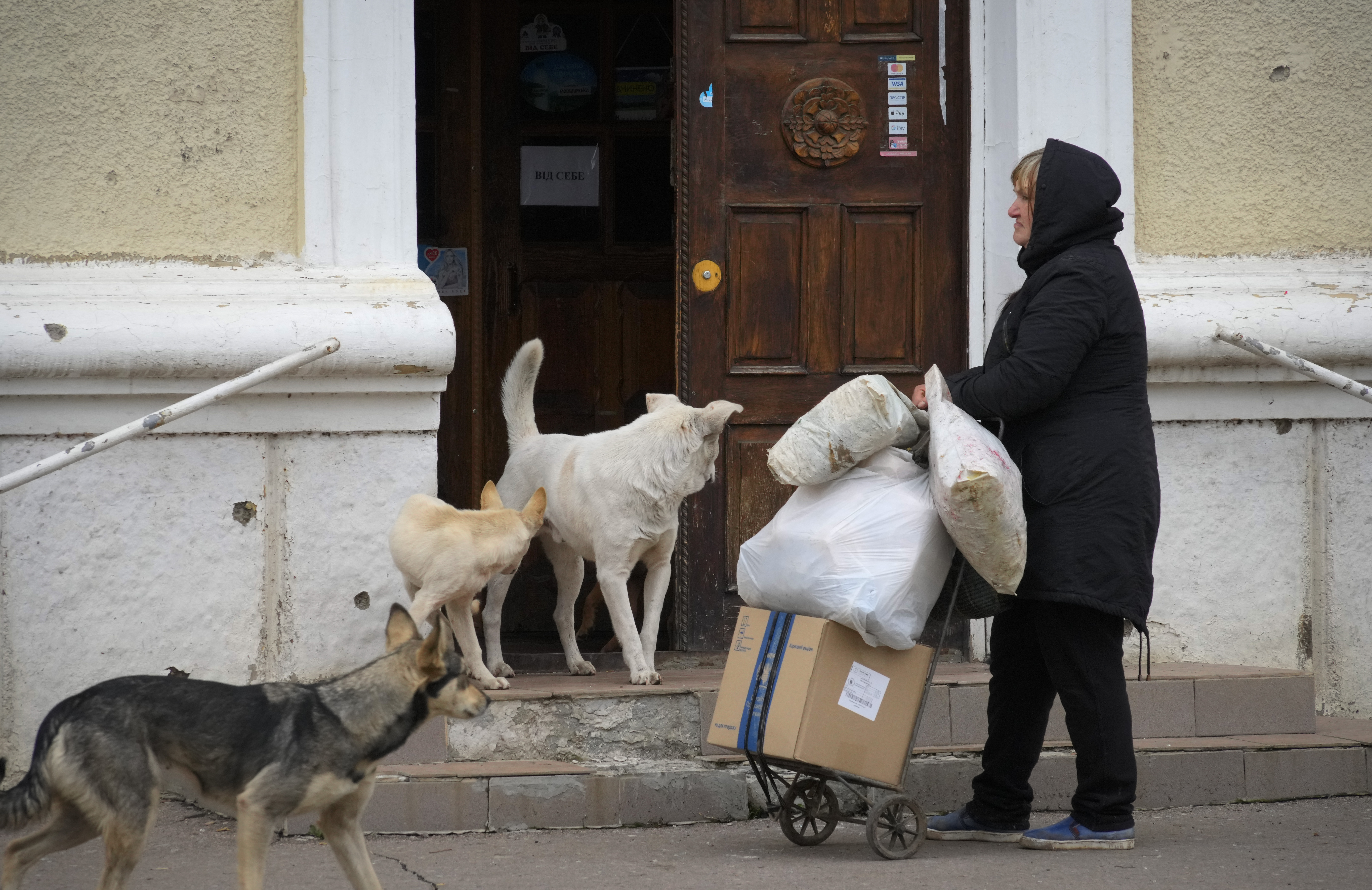 A woman waits for free bread in Bakhmut, the site of the heaviest battle against the Russian troops in the Donetsk region, Ukraine, Friday.
