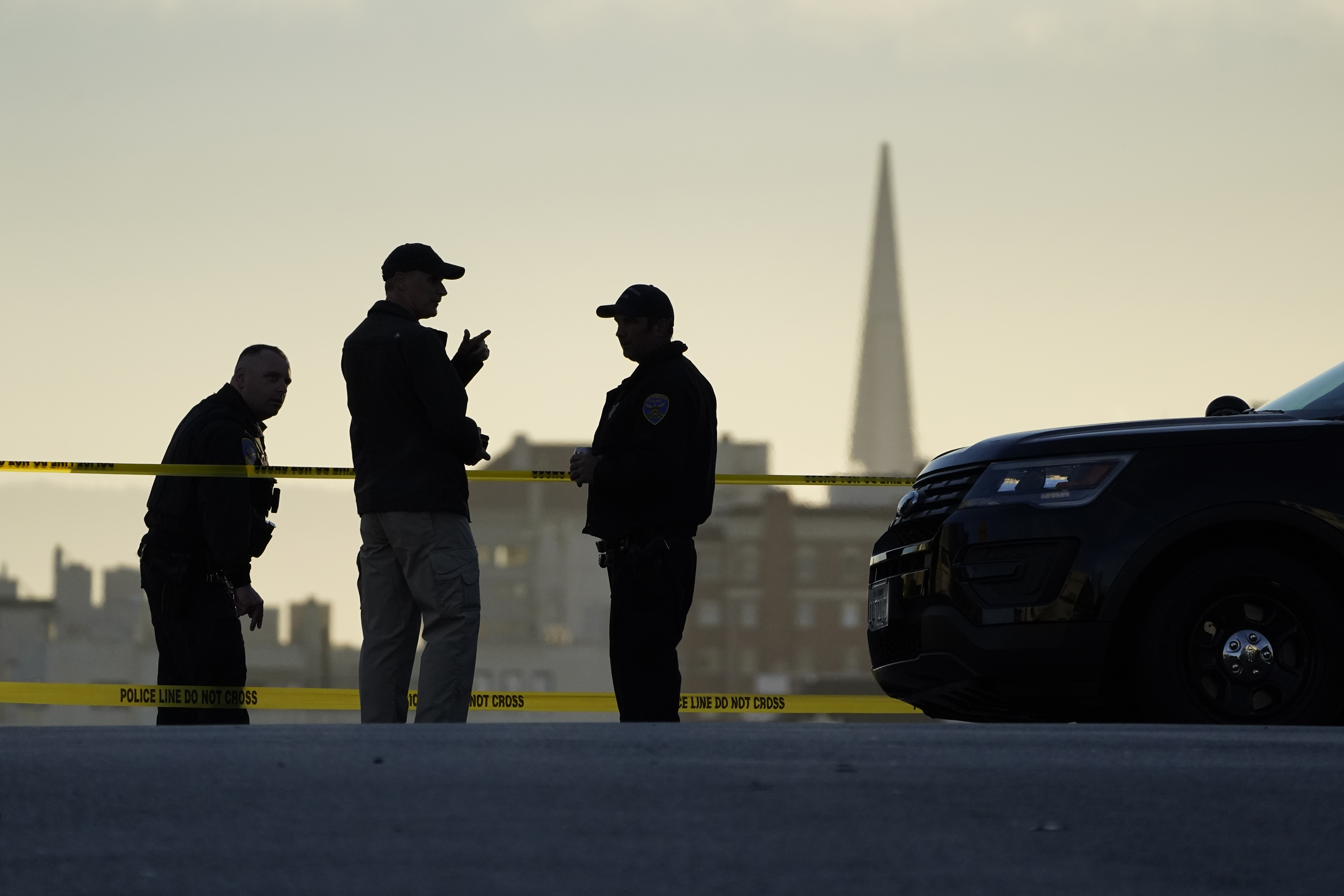 Police stand at the top of the closed street outside the home of Paul Pelosi, the husband of House Speaker Nancy Pelosi, in San Francisco, Friday. Paul Pelosi, was attacked and severely beaten by an assailant with a hammer who broke into their San Francisco home early Friday.