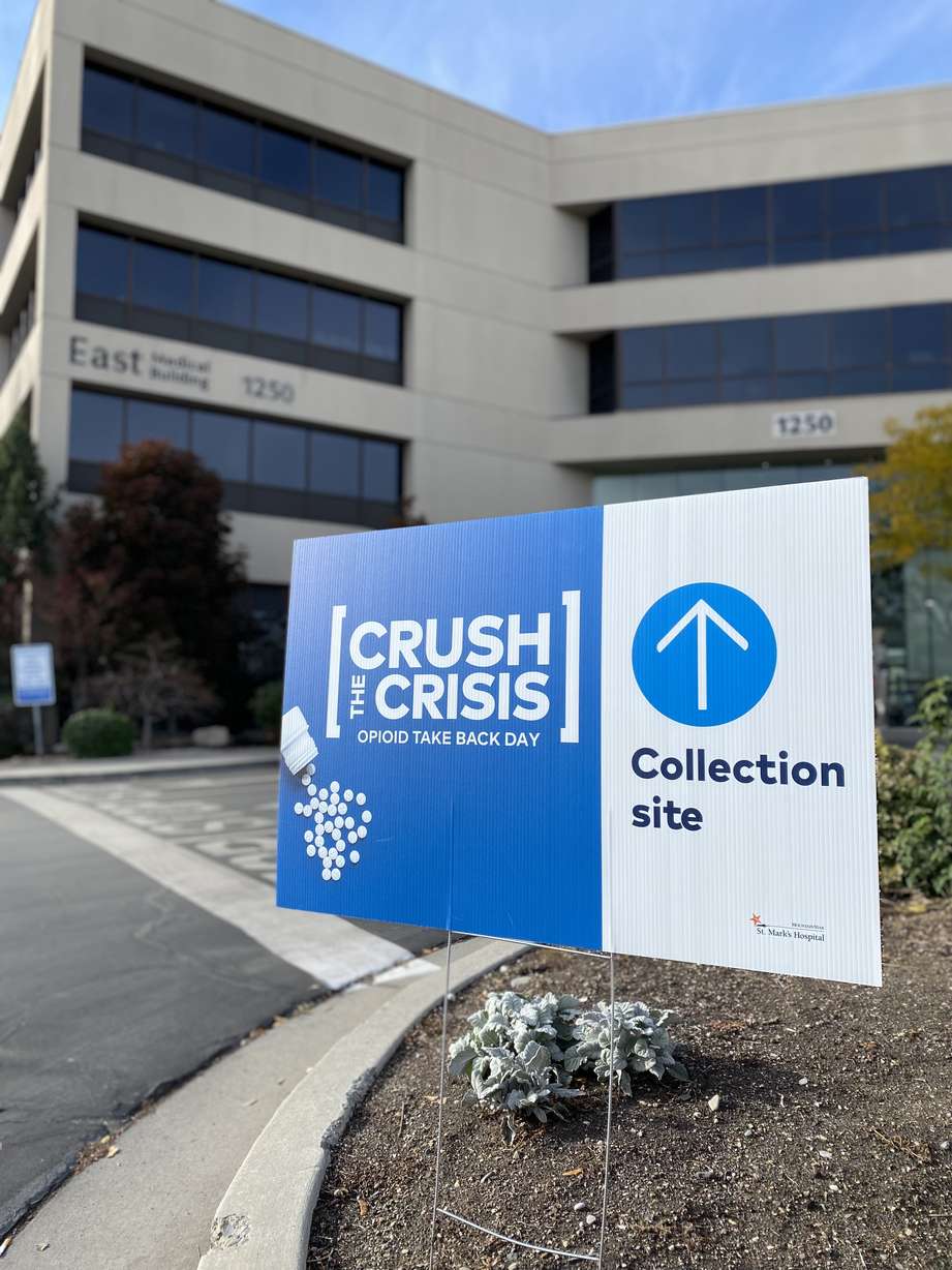 A "Crush the Crisis" sign is pictured at St. Marks Hospital in Millcreek on Saturday. In an effort to mitigate the opioid crisis, many Utah law enforcement agencies on Saturday participated in the National Prescription Drug Take Back Day.