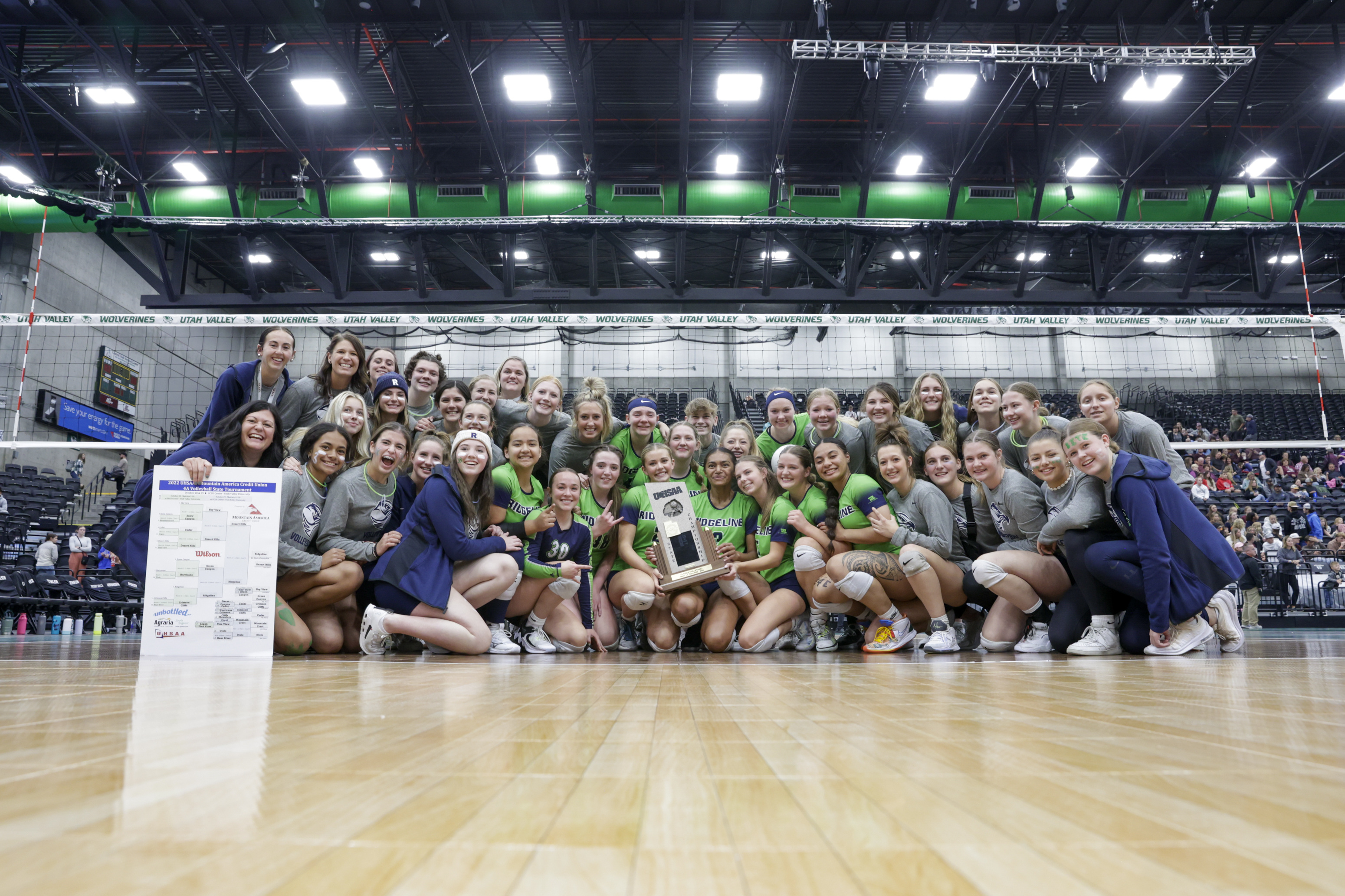 The Ridgeline Riverhawks celebrate on the court after beating the Desert Hills Thunder in the 4A volleyball state championship in Orem on Saturday, Oct. 29, 2022.