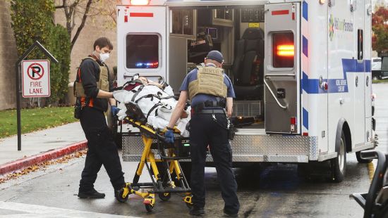 First responders treat a person at the Boise Towne Square shopping mall after a man opened fire at the mall on Oct. 25, 2021, in Boise. Jacob Bergquist entered the mall and fatally shot a security guard and another man and wounded four others. Advocates say permitless carry makes people safer. Opponents say it makes it more dangerous for ordinary people, and for police officers.