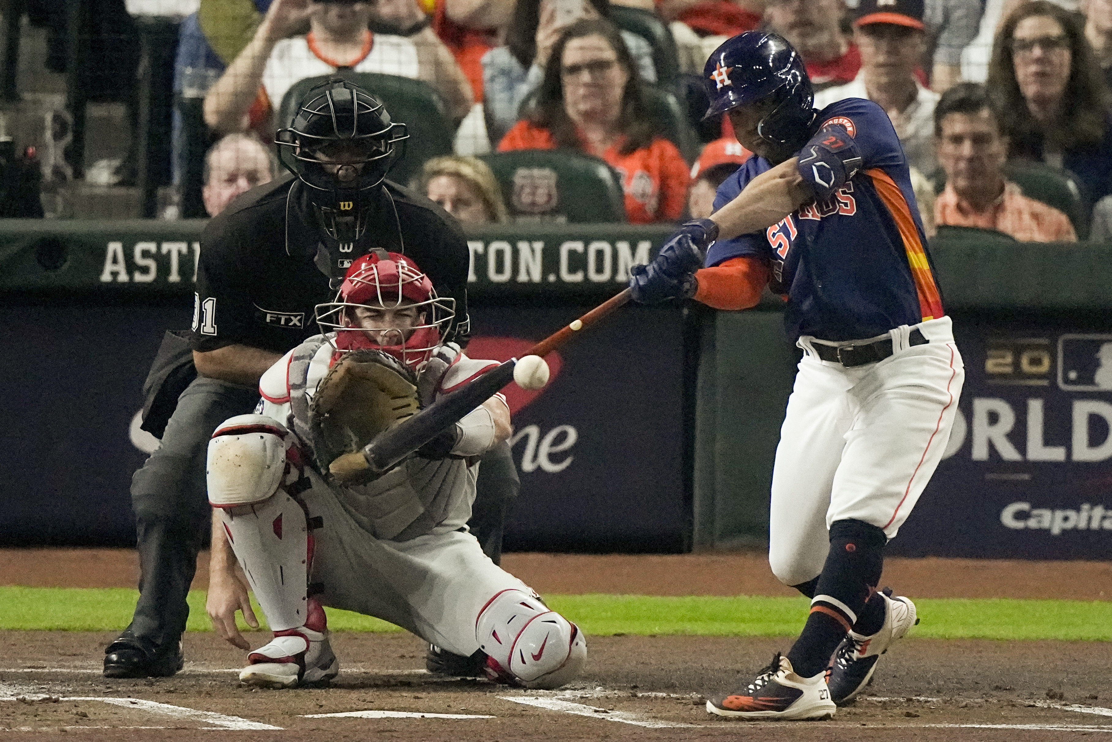 Houston Astros' Jose Altuve hits a double during the first inning in Game 2 of baseball's World Series between the Houston Astros and the Philadelphia Phillies on Saturday, Oct. 29, 2022, in Houston. 