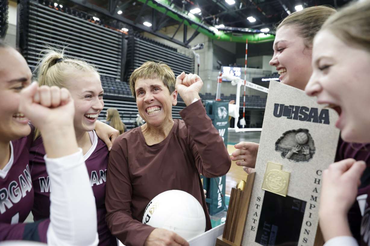 Morgan coach Liz Wiscombe celebrates with her team after winning the 3A state volleyball tournament after beating the Richfield Wildcats in Orem on Saturday, Oct. 29, 2022. The Trojans won 3-1.