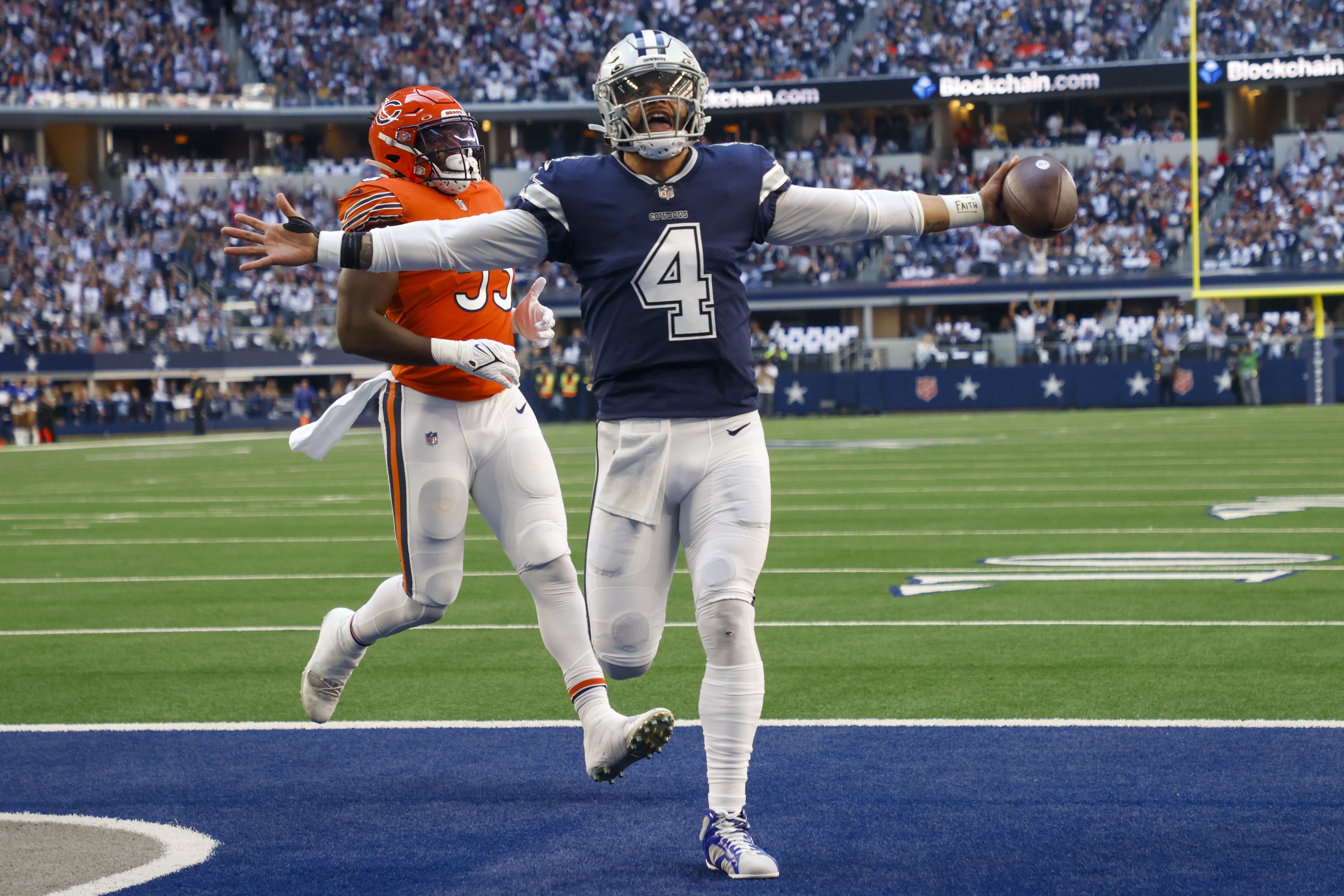 Dallas Cowboys' Dak Prescott runs for a touchdown during the first half of an NFL football game against the Chicago Bears Sunday, Oct. 30, 2022, in Arlington, Texas. 