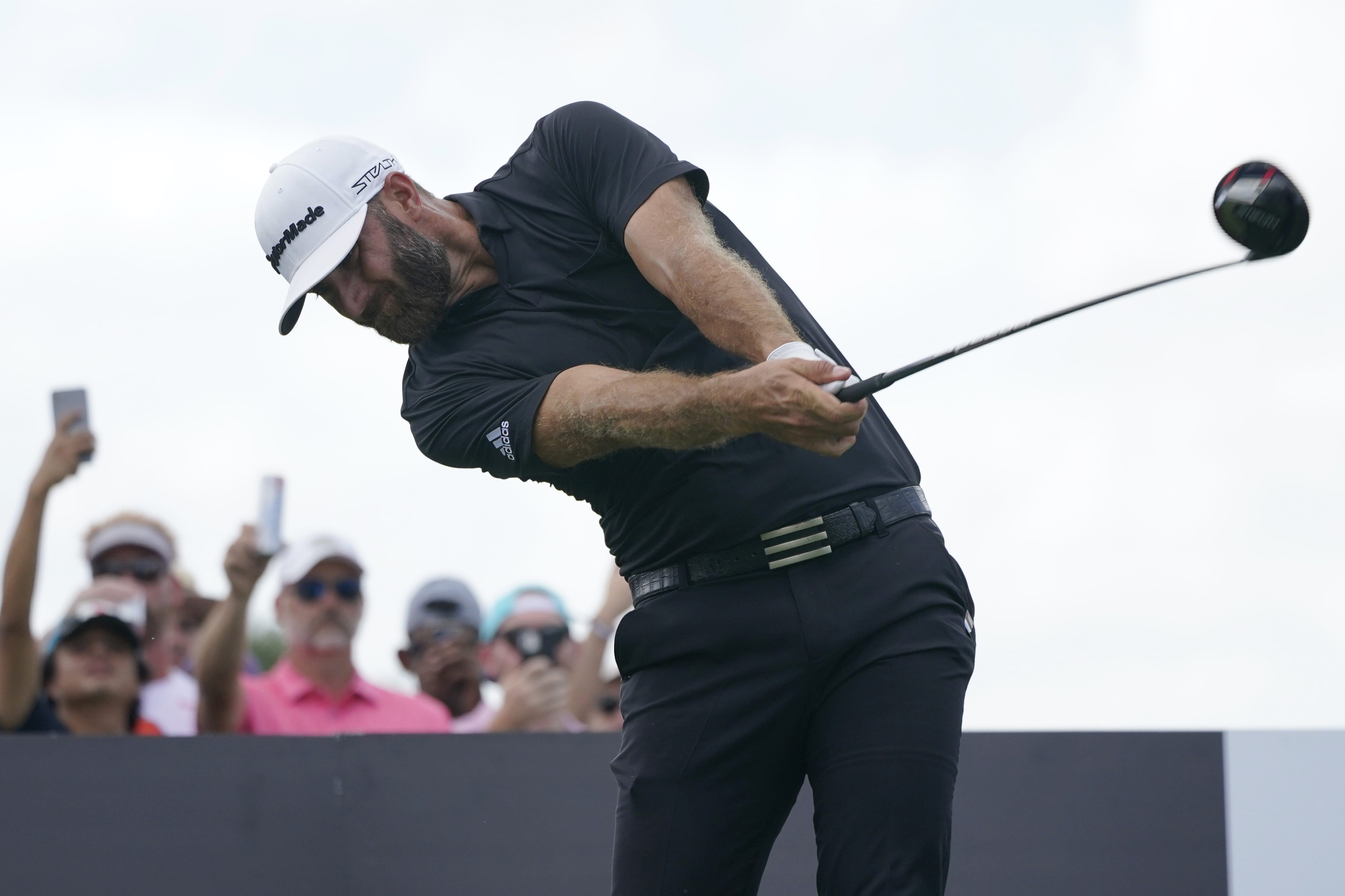 Dustin Johnson hits from the third tee during the final round of the LIV Golf Team Championship at Trump National Doral Golf Club, Sunday, Oct. 30, 2022, in Doral, Fla. 