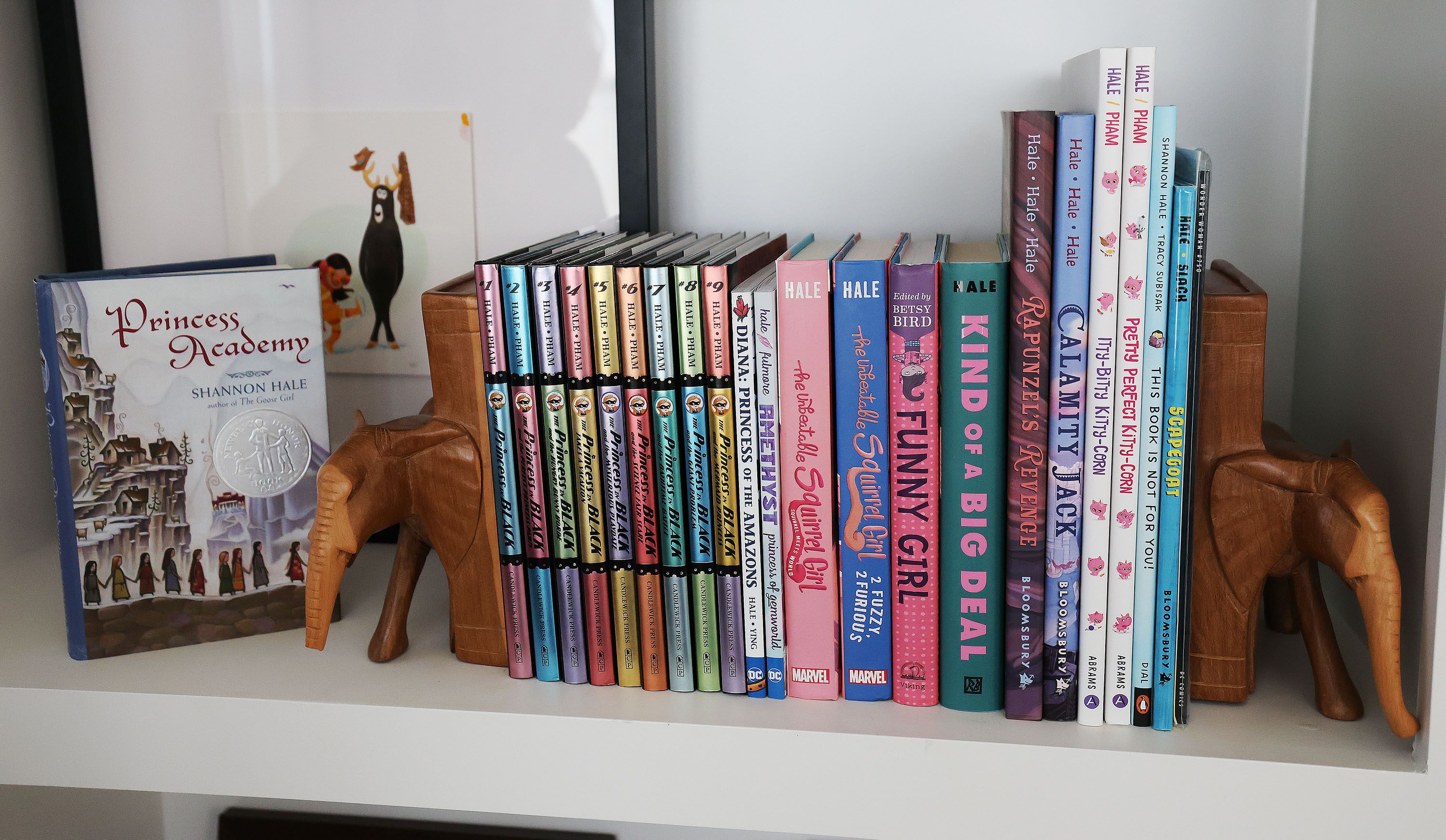 Books that Shannon Hale has written at her home in South Jordan on Oct. 12. Hale is leading a collective of children’s book writers condemning the banning and suppression of kids’ books.