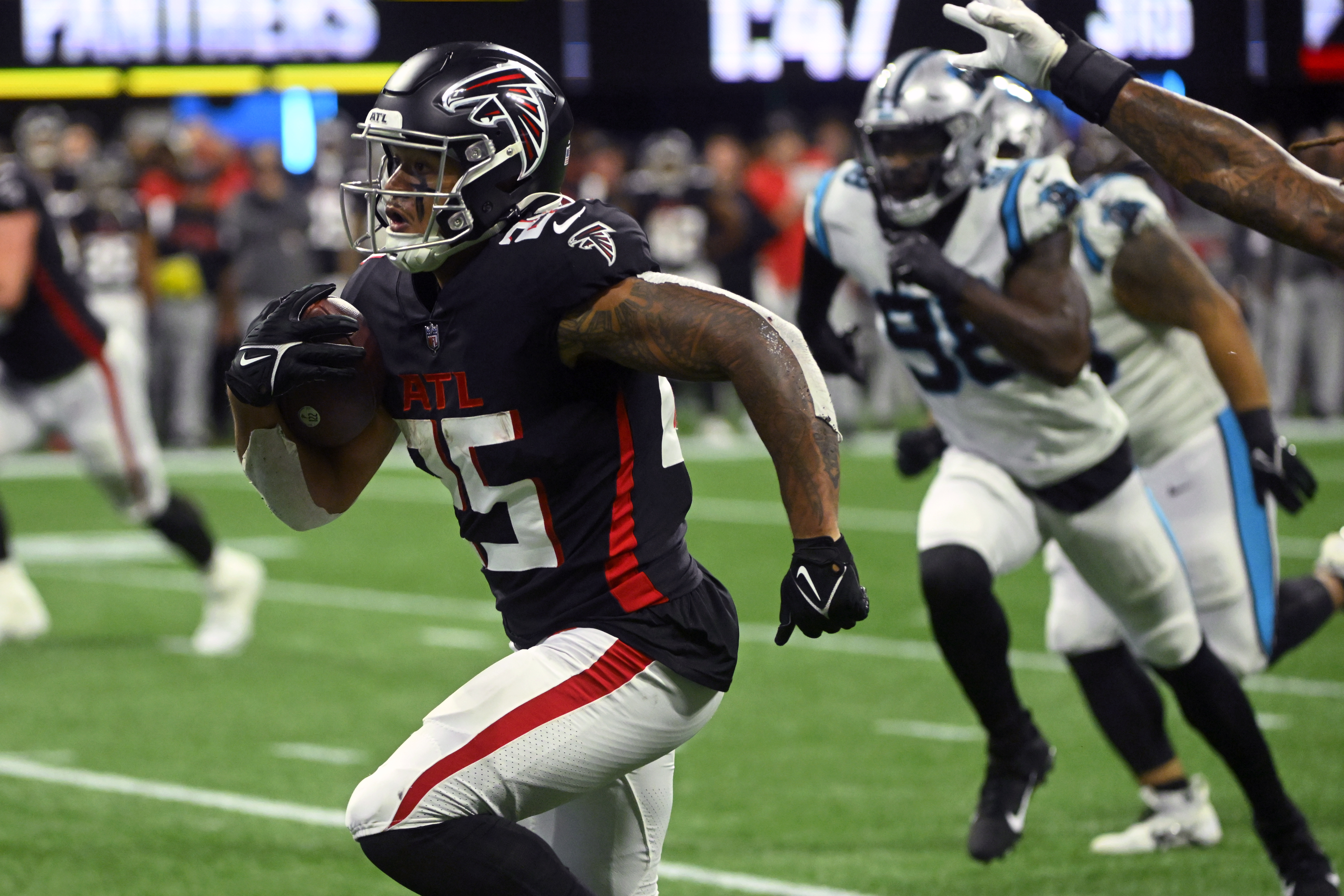 Atlanta Falcons running back Tyler Allgeier heads for the end zone during the second half of an NFL football game against the Carolina Panthers Sunday, Oct. 30, 2022, in Atlanta.