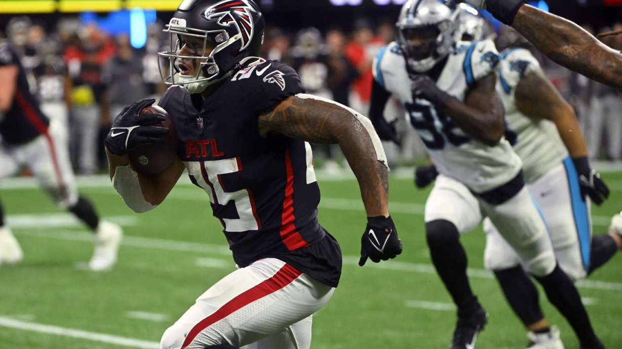 Atlanta Falcons running back Tyler Allgeier heads for the end zone during the second half of an NFL football game against the Carolina Panthers Sunday, Oct. 30, 2022, in Atlanta.