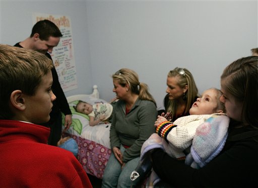 Formerly conjoined twins Kendra, right, and Maliyah Herrin check out their room with separate beds at the their home. (AP Photo/Douglas C. Pizac, Pool)