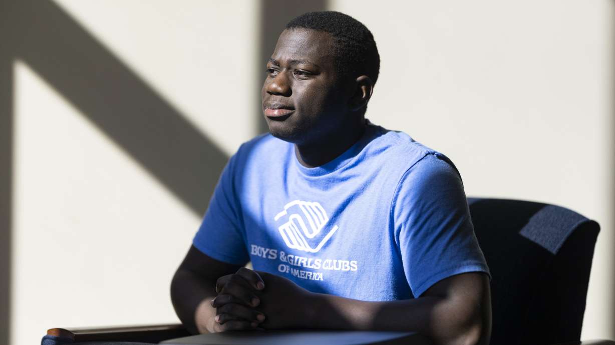 Steeve Biondolillo sits for a portrait on campus at Northwest Nazarene University in Nampa, Idaho, on Oct. 7. With an early childhood in Haiti marked by poverty and other trauma, 19-year-old Biondolillo seems to have beat long odds.