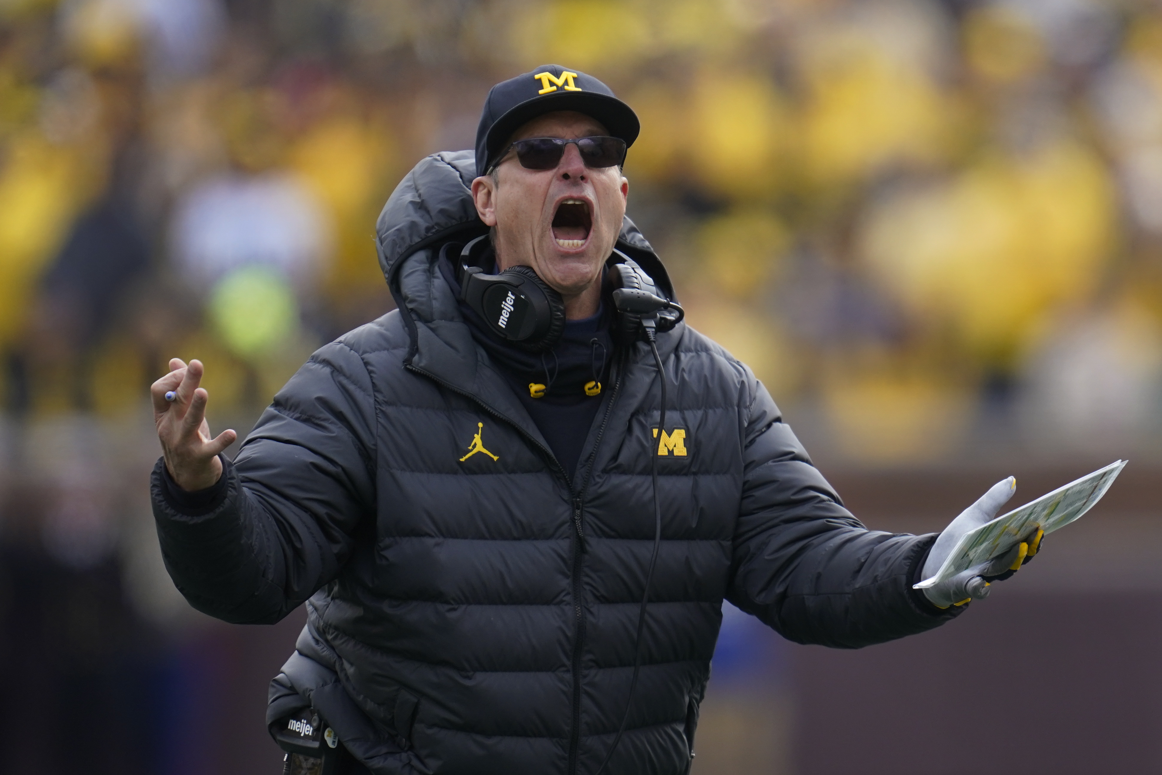 Michigan head coach Jim Harbaugh argues a call against Penn State in the second half of an NCAA college football game in Ann Arbor, Mich., Saturday, Oct. 15, 2022. 