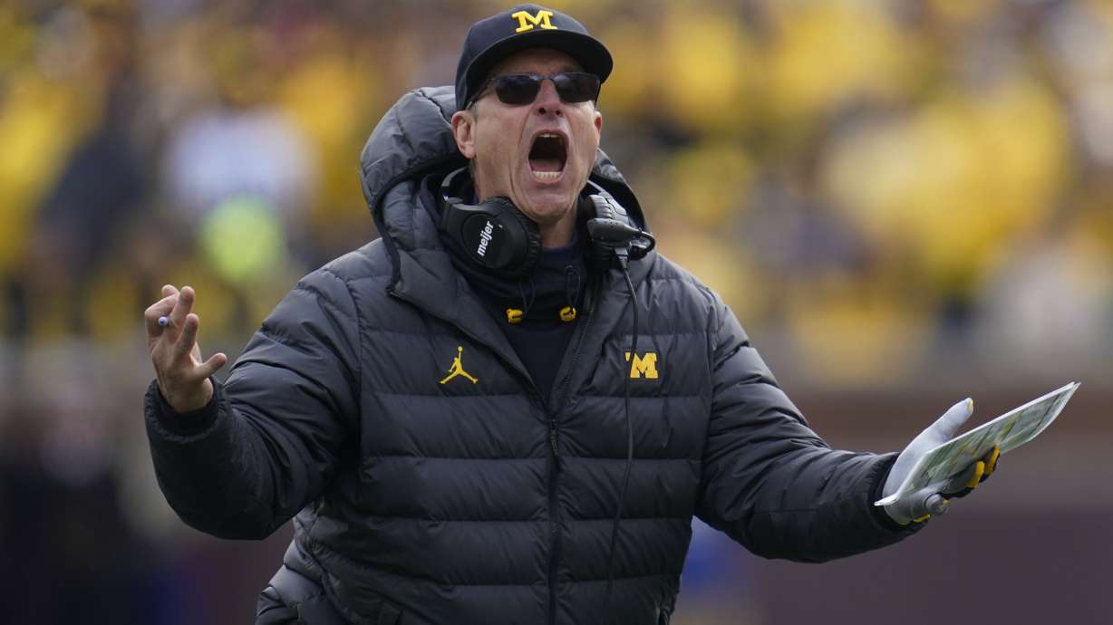 Michigan head coach Jim Harbaugh argues a call against Penn State in the second half of an NCAA college football game in Ann Arbor, Mich., Saturday, Oct. 15, 2022.